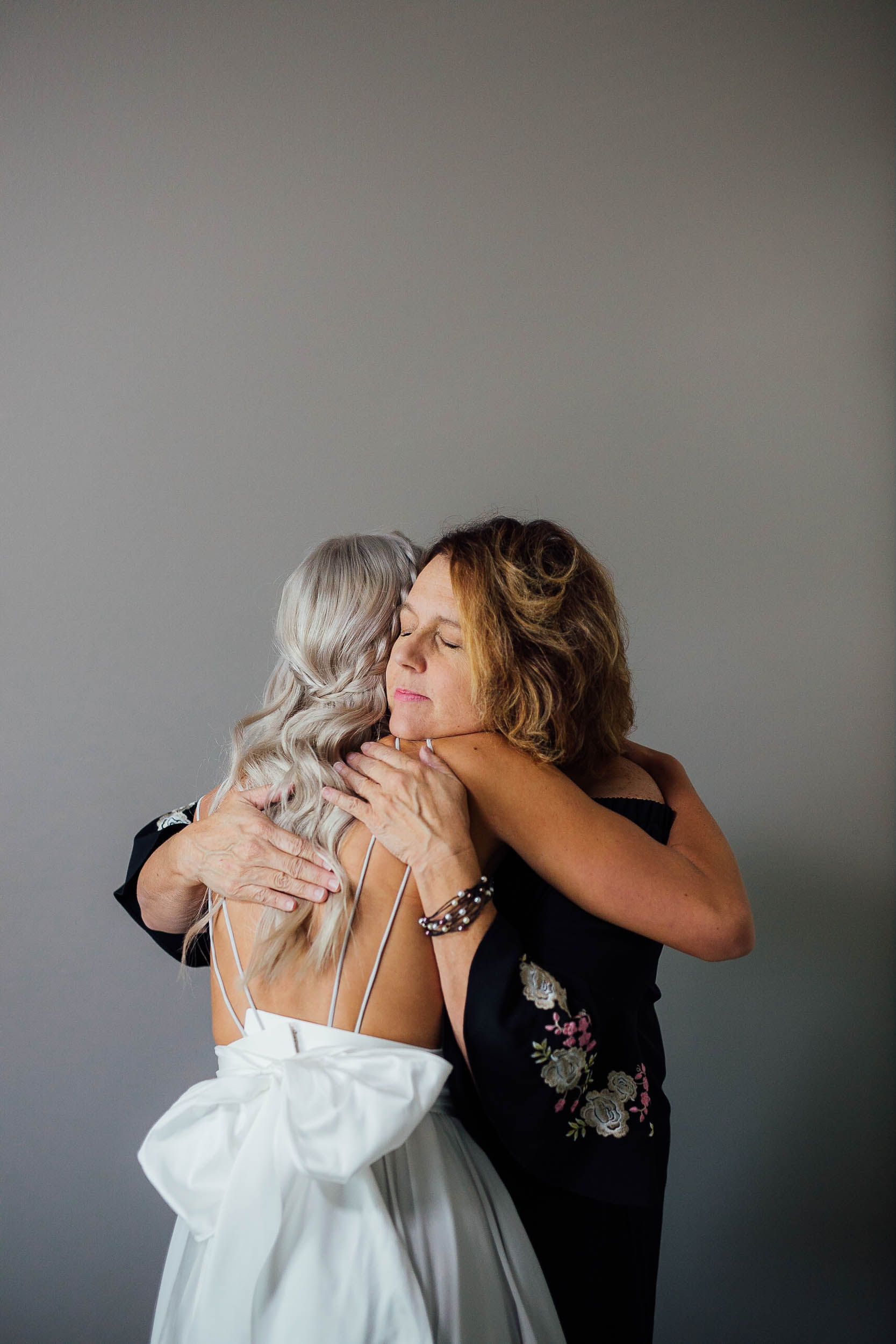 Intimate moment between bride and mother of the bride