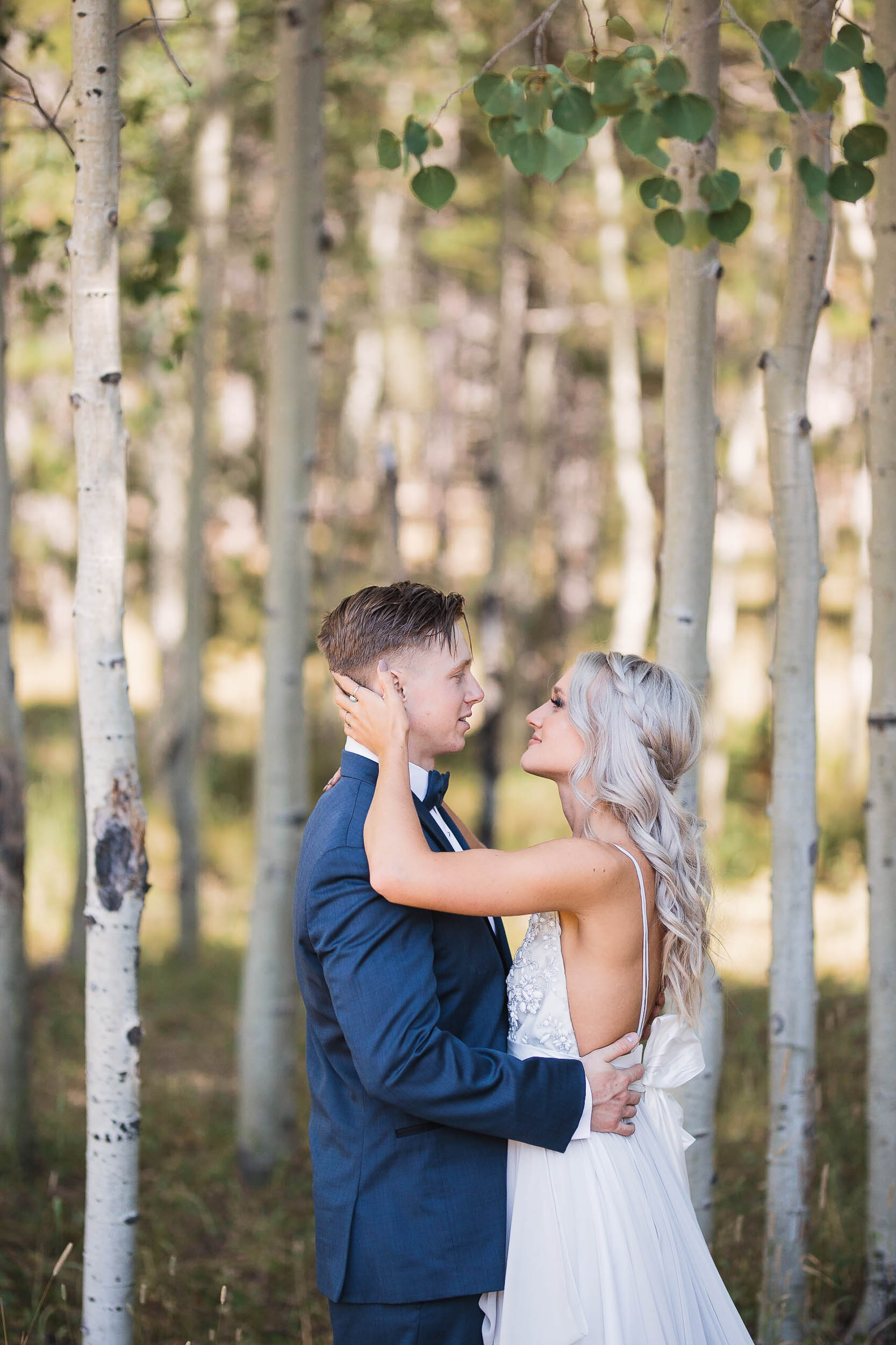 Bride and groom portraits in front of aspen trees