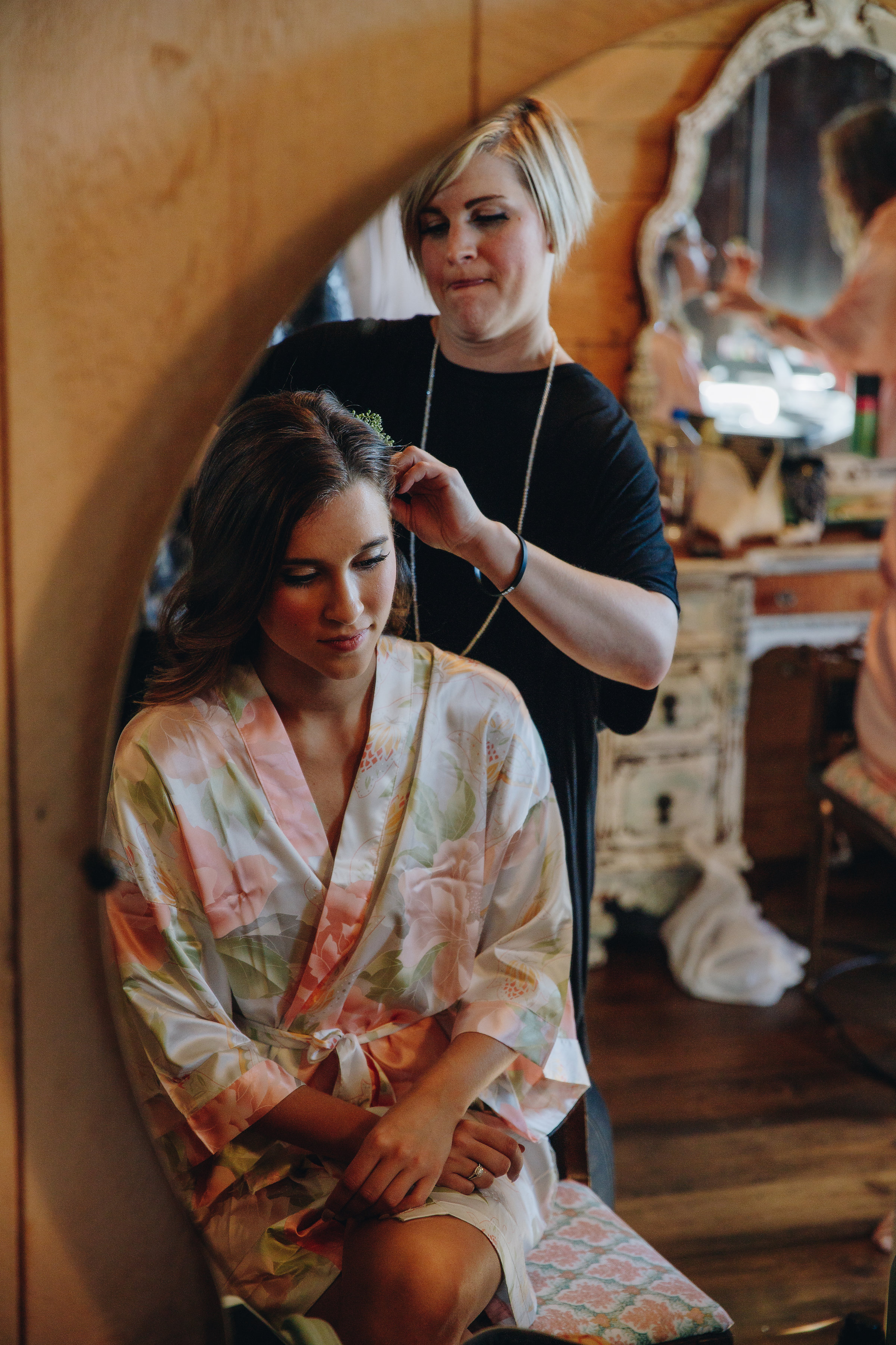 Twin Cities bride getting her hair done on her wedding day