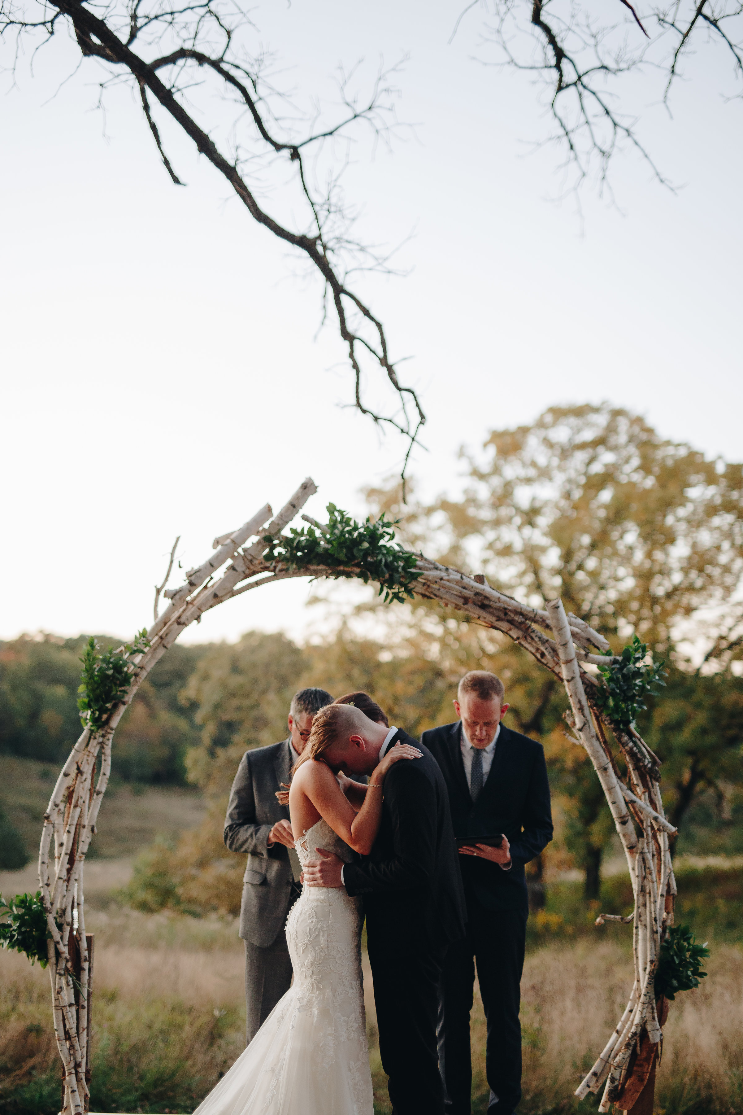 Bride and Groom praying together during wedding ceremony Twin Cities