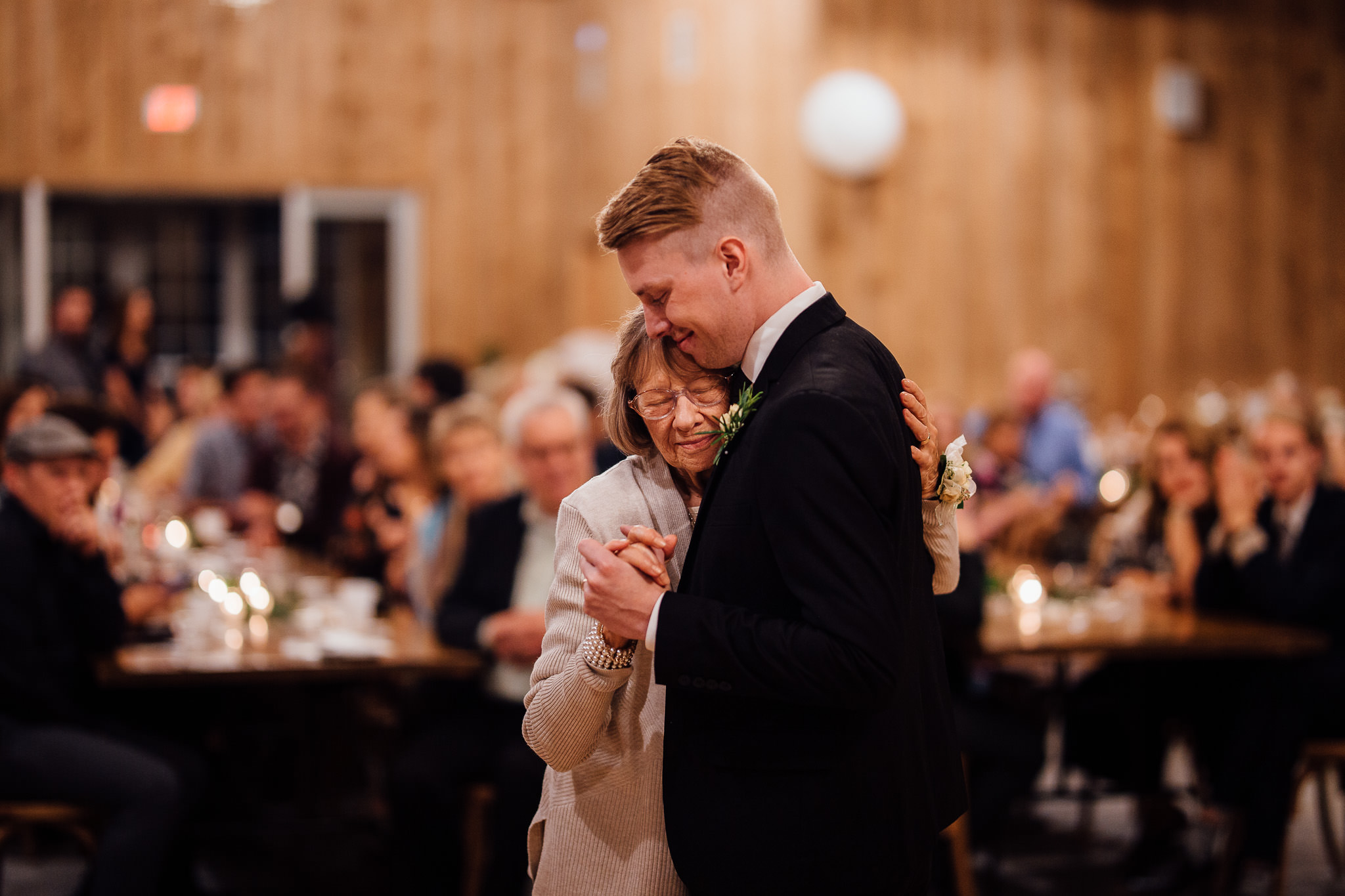 Groom dancing with grandma wedding moments captured by photographer