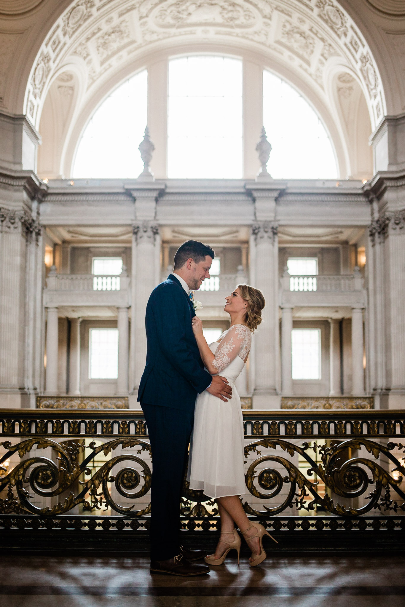 Bride and Groom posing for wedding portraits in San Francisco City Hall