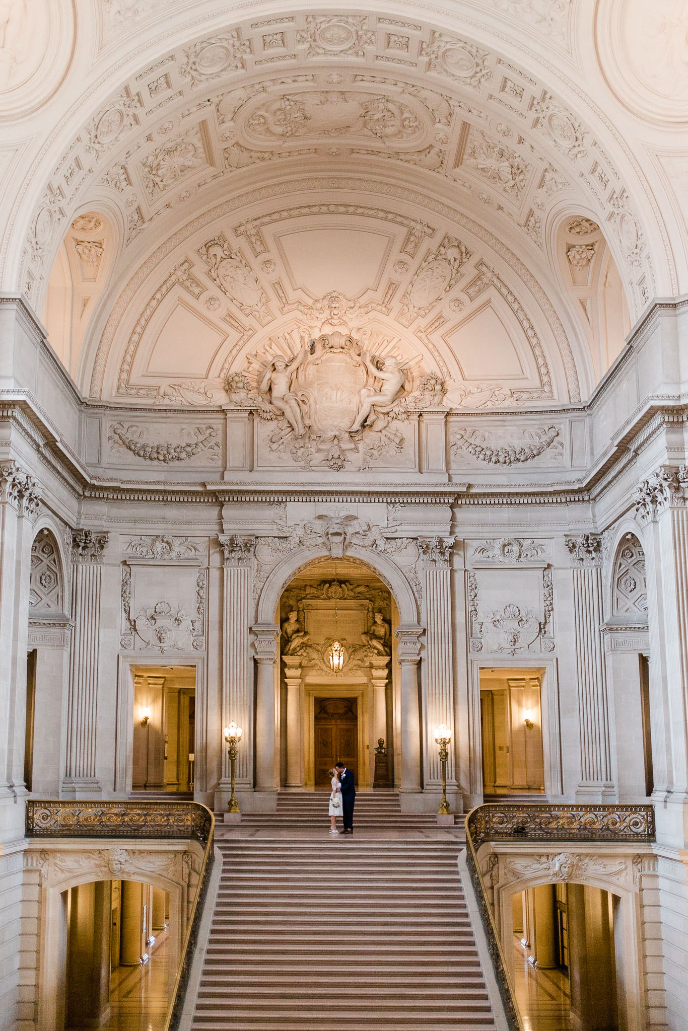 Bride and Groom posing for wedding portraits in San Francisco City Hall