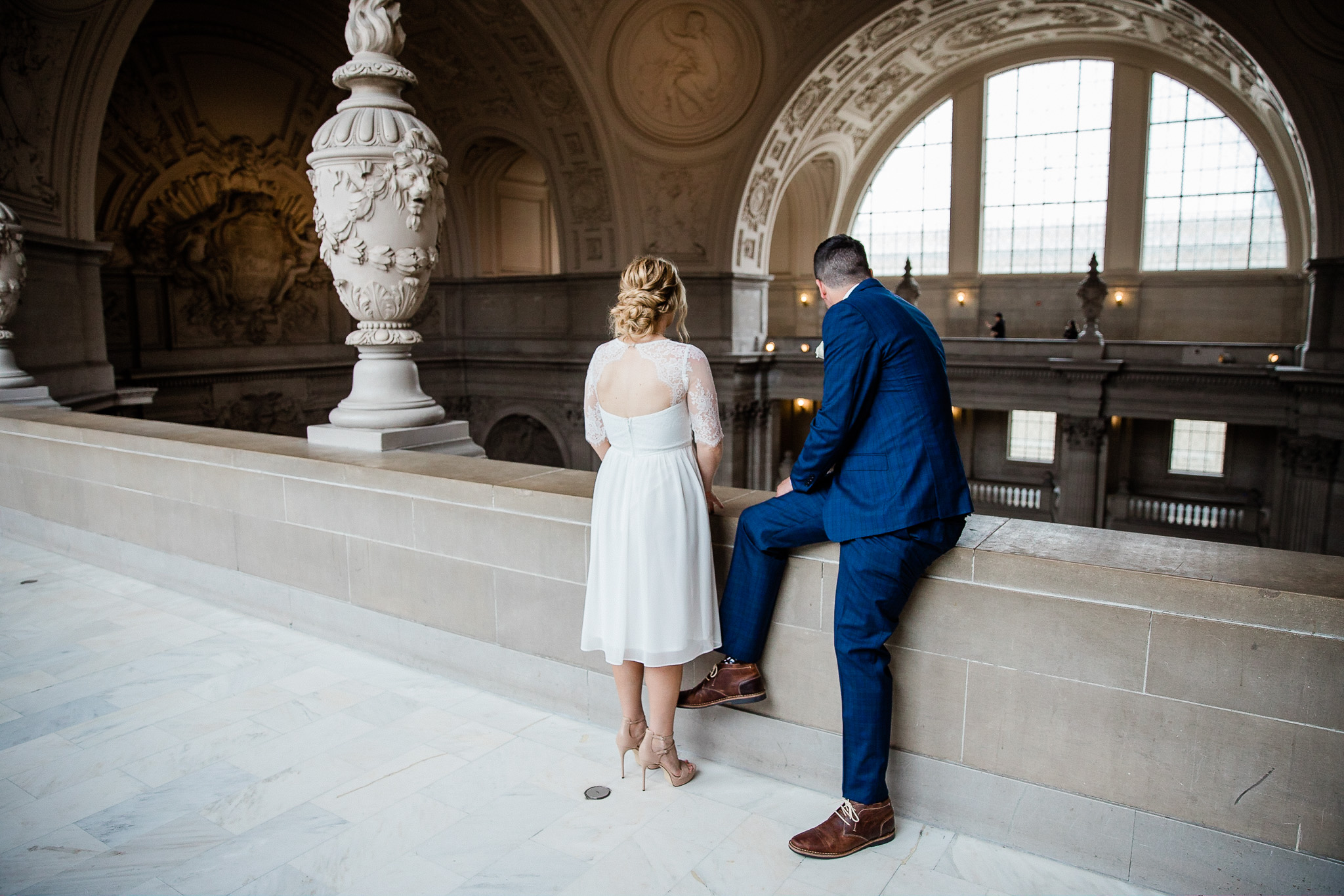 Bride and Groom posing for wedding portraits in San Francisco City Hall