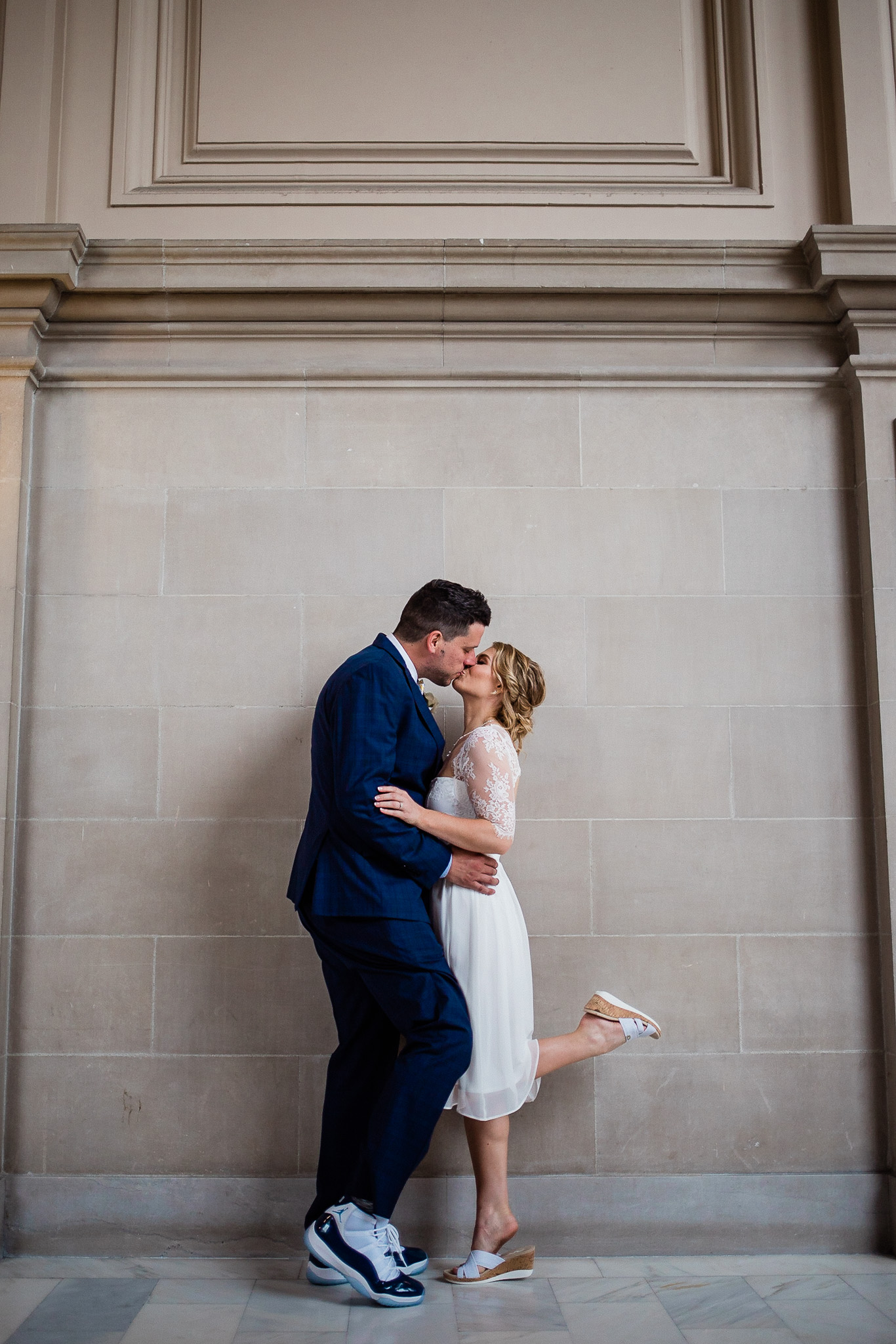 Bride and Groom pose for wedding portraits in San Francisco City Hall