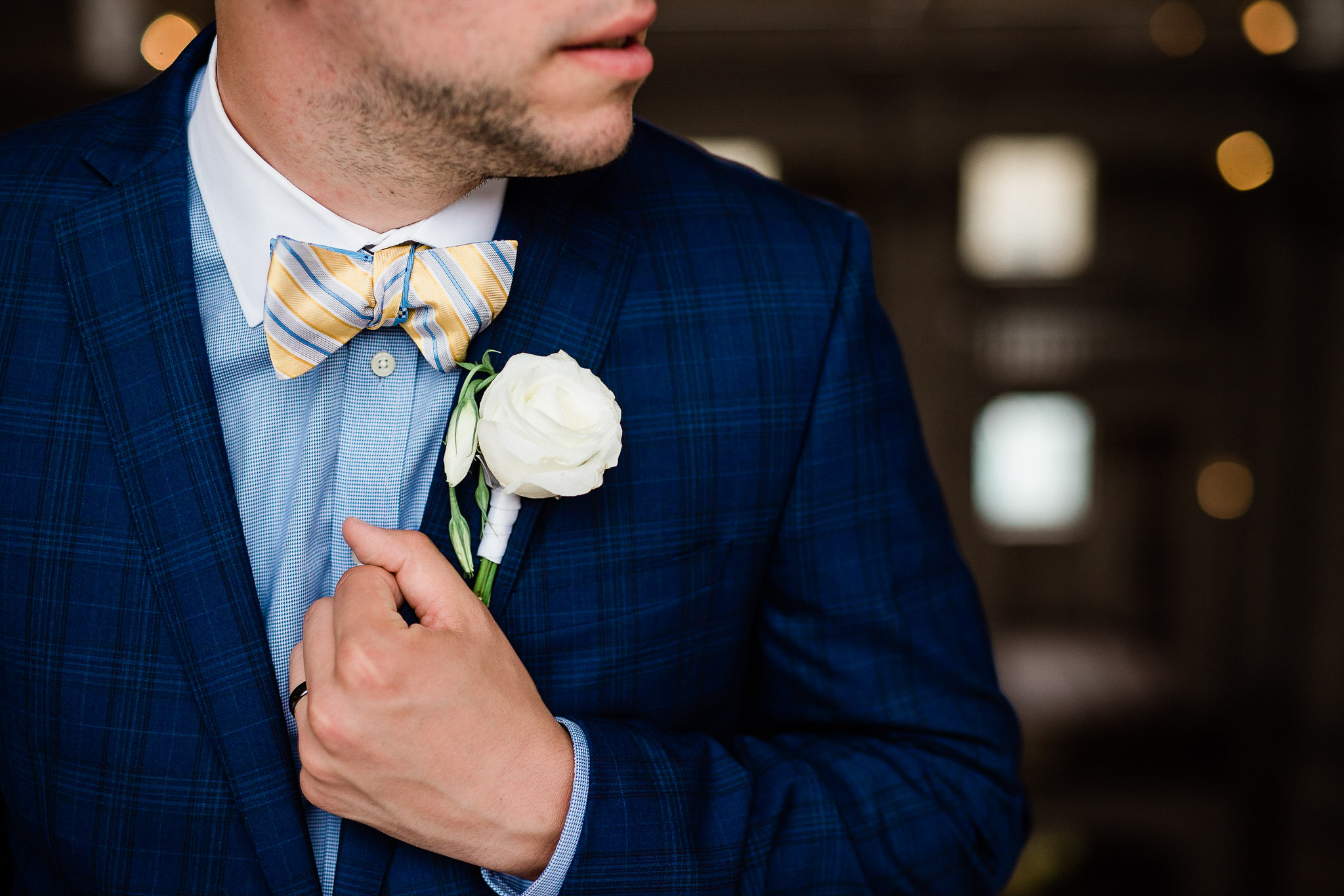 Groom poses for wedding portraits in San Francisco City Hall