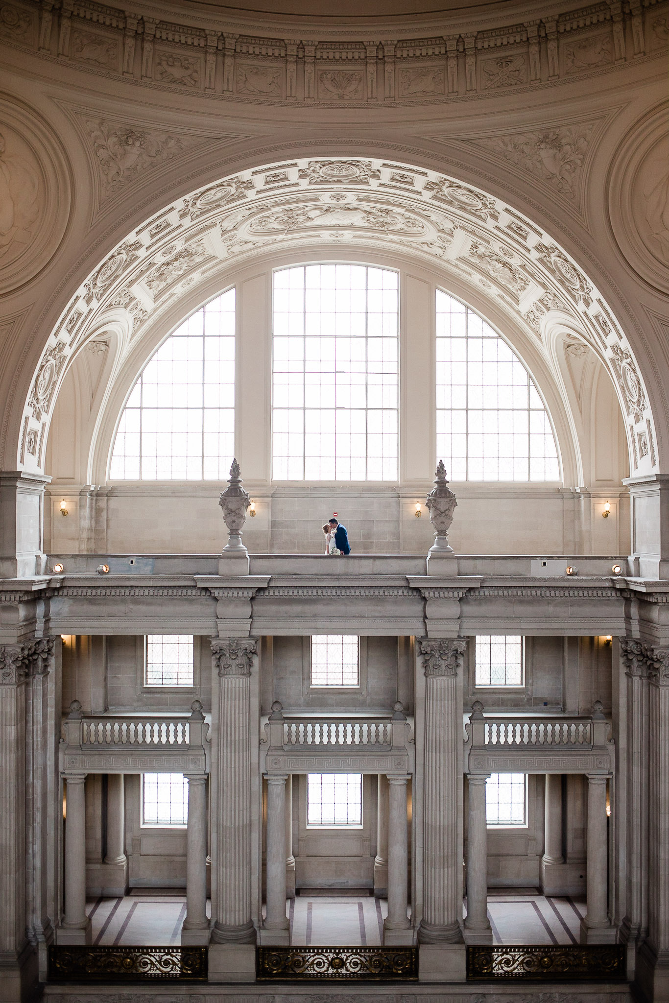 Bride and Groom pose for wedding portraits in San Francisco City Hall