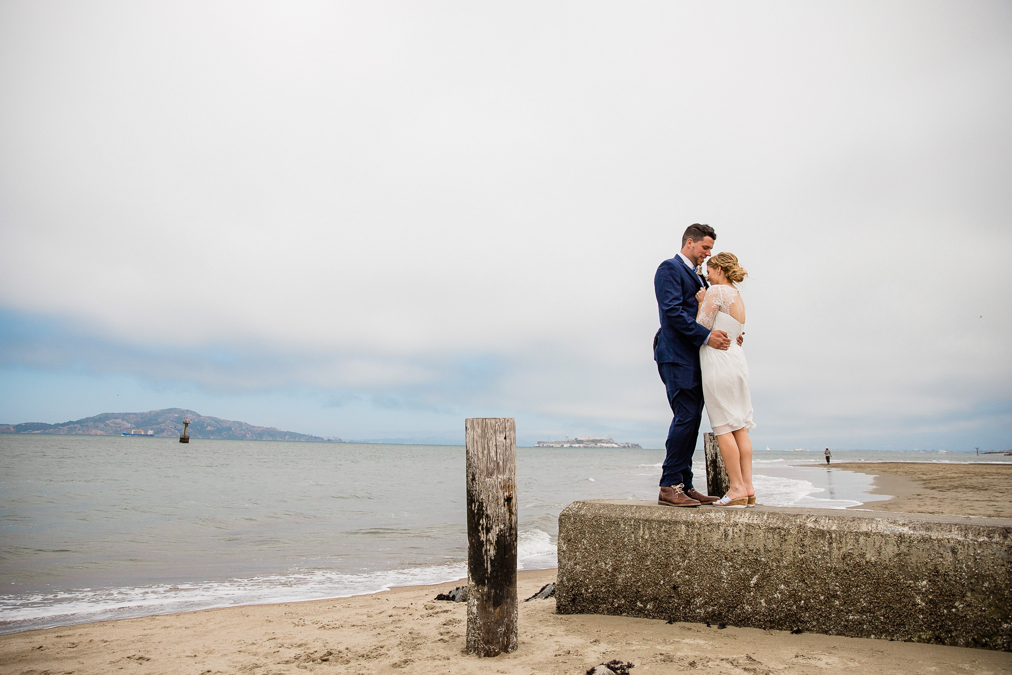 Bride and Groom pose for wedding photos near the Golden gate bridge