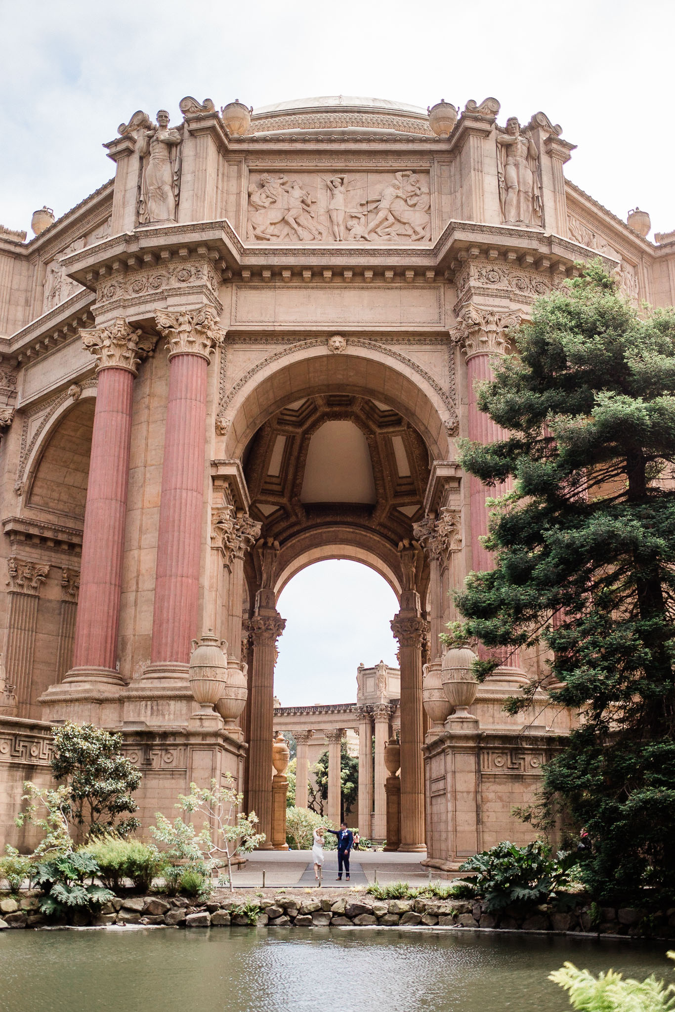 Bride and Groom pose for wedding photos near the Palace of Fine arts in San Francisco
