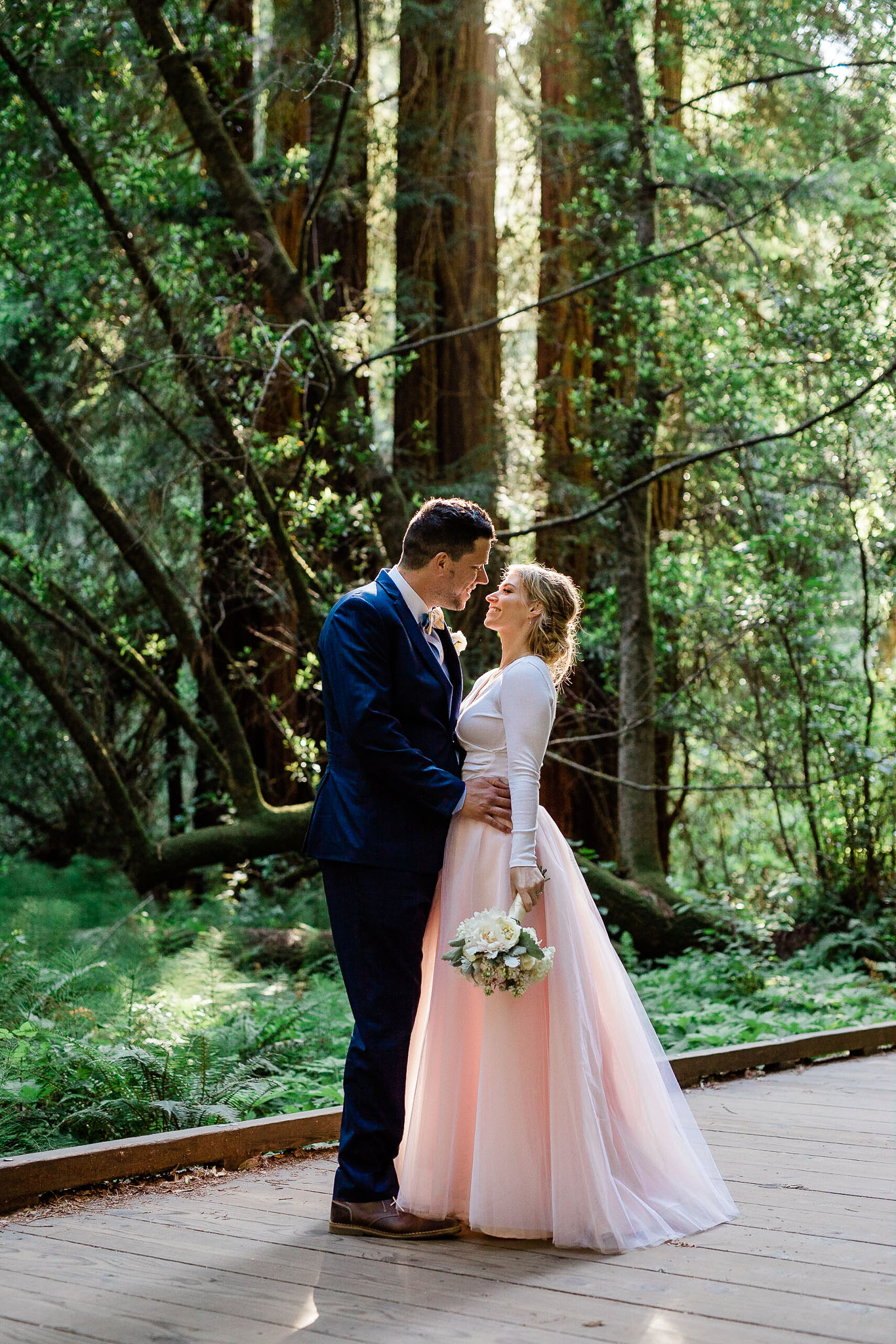 Bride and Groom pose for wedding photos in the Muir Woods National Monument