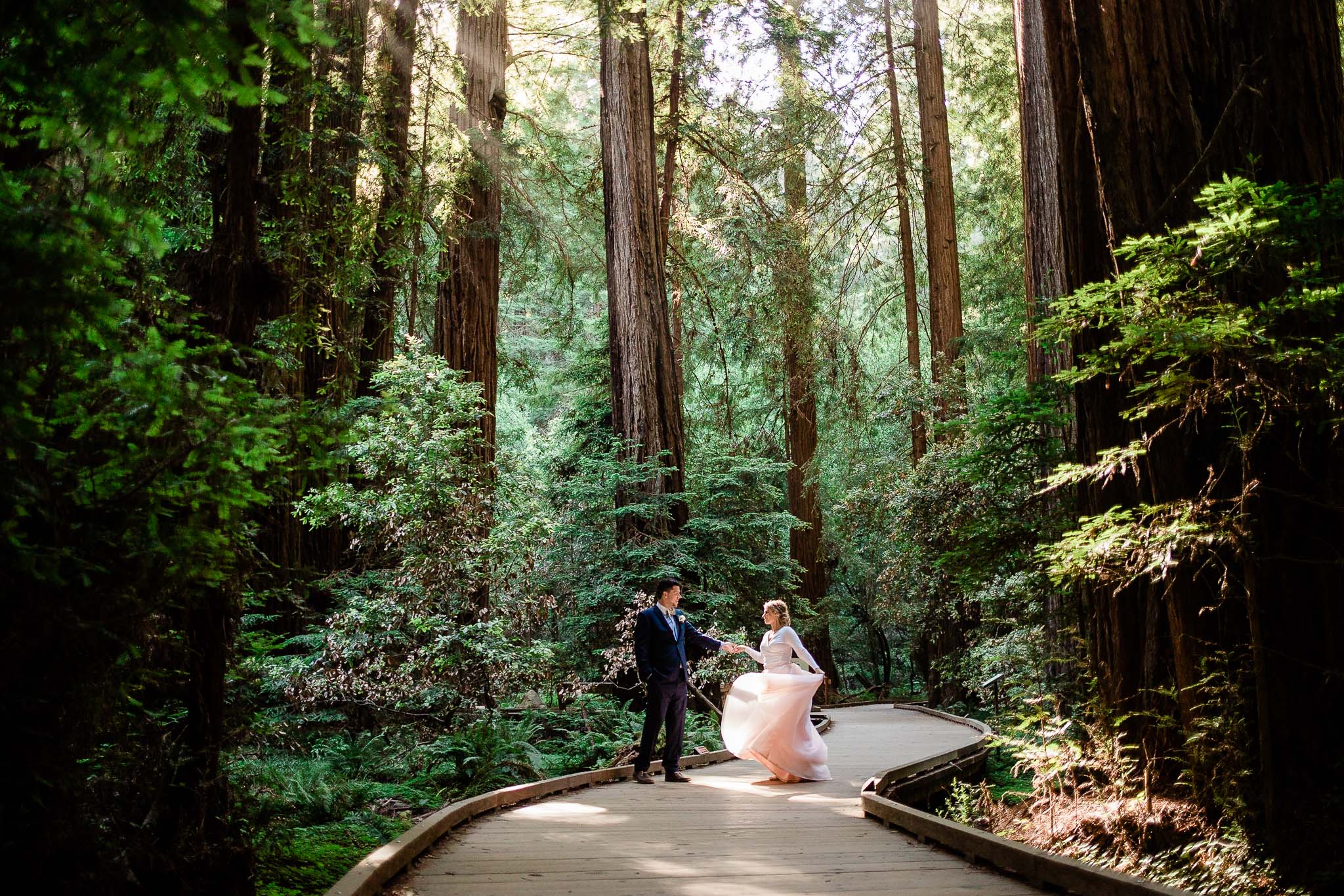 Bride and Groom pose for wedding photos in the Muir Woods National Monument