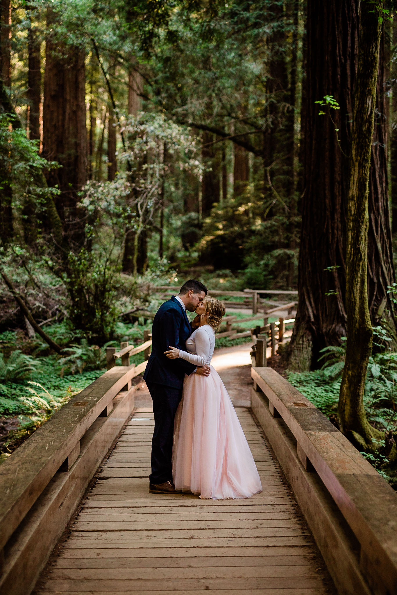 Bride and Groom pose for wedding photos in the Muir Woods National Monument