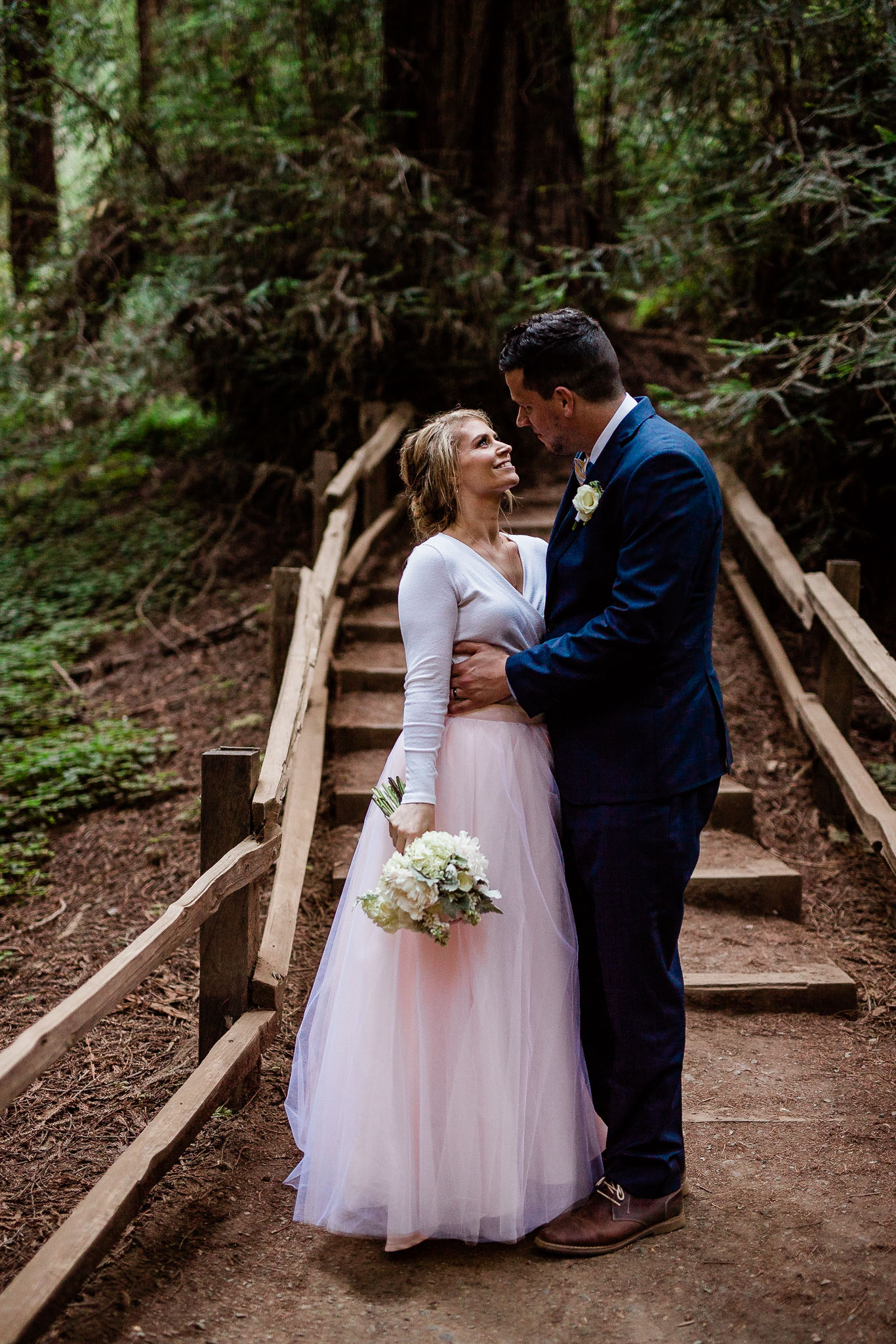 Bride and Groom pose for wedding photos in the Muir Woods National Monument