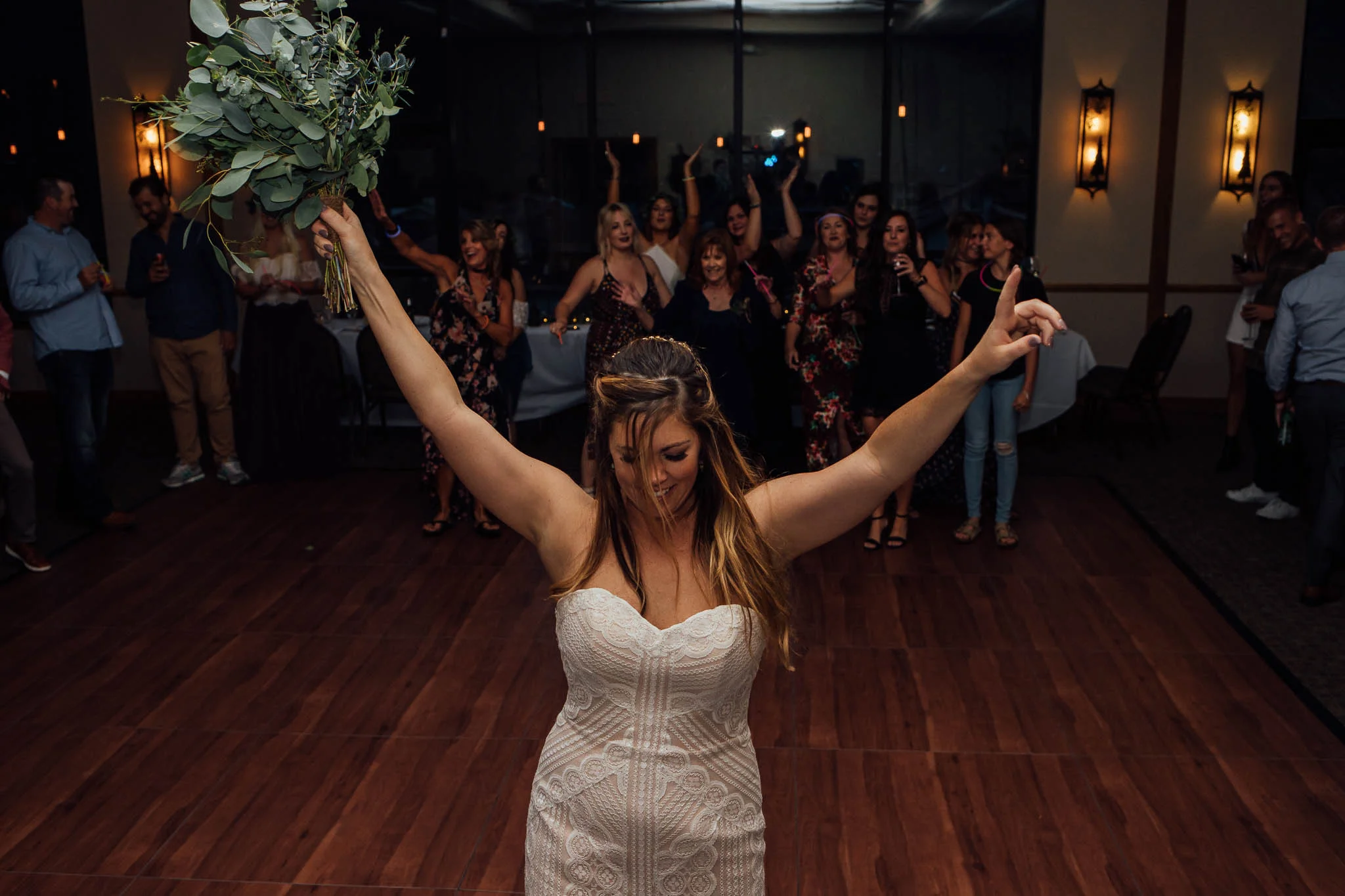Bride gets ready to throw bouquet Colorado Mountain wedding photographer winter park resort