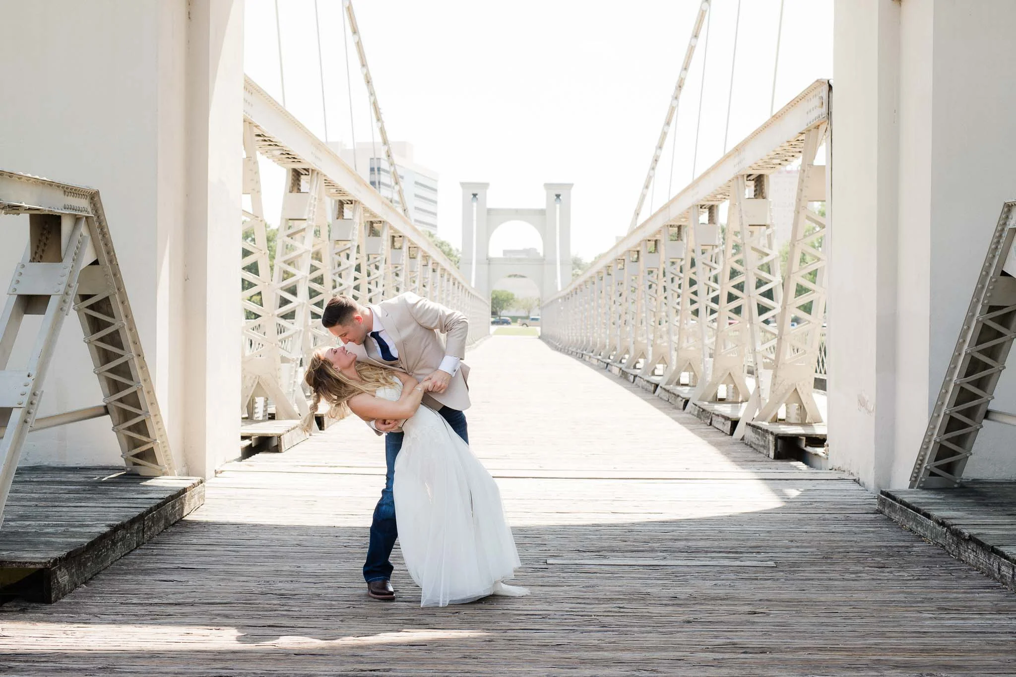 Bride and groom first look at bridge in Waco Texas