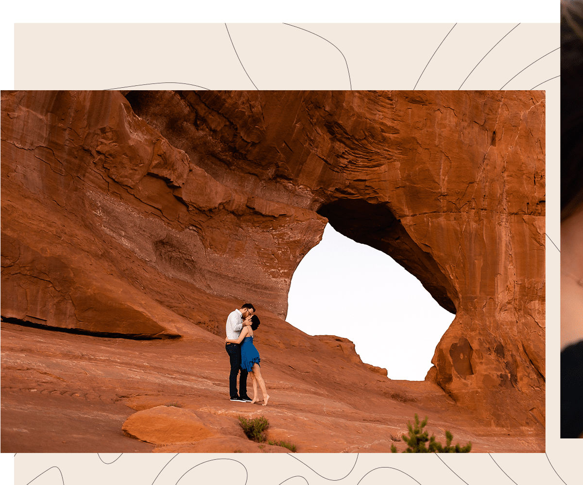 Couple pose in front of arch for couples photoshoot near Moab Utah