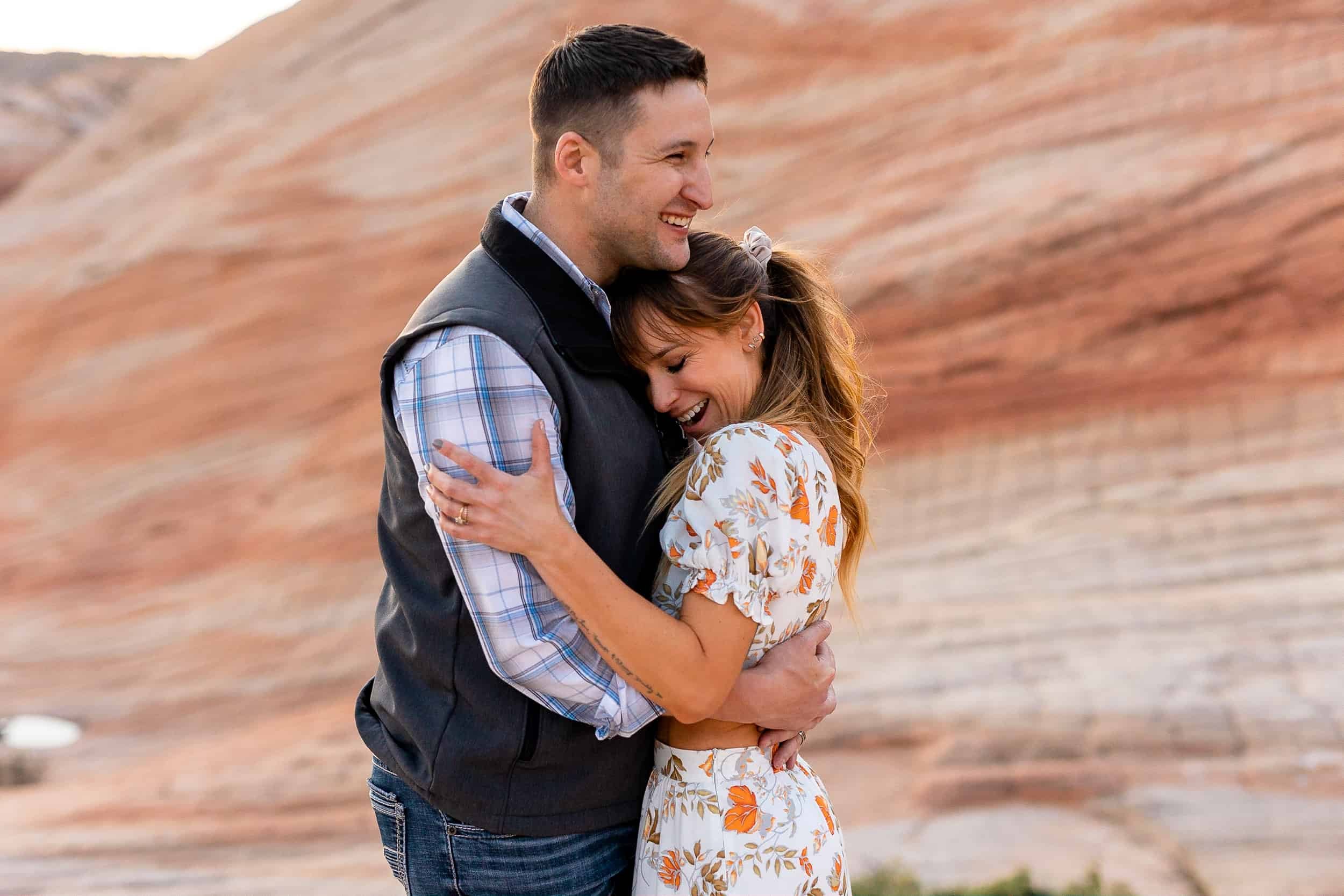 Couple hug each other close during their Southern Utah adventure anniversary photos