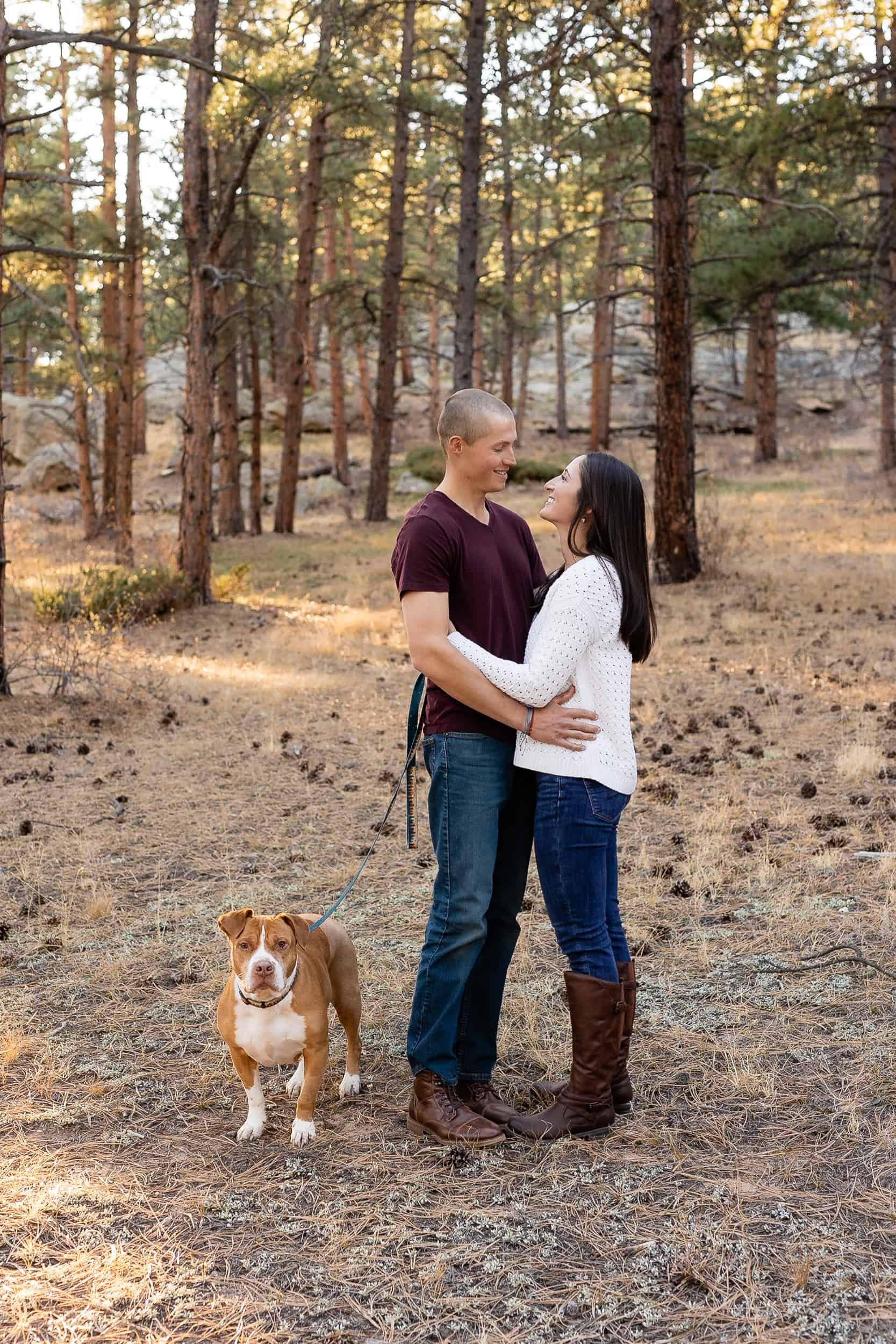 Couple pose for an anniversary photoshoot with their dog in Denver Colorado