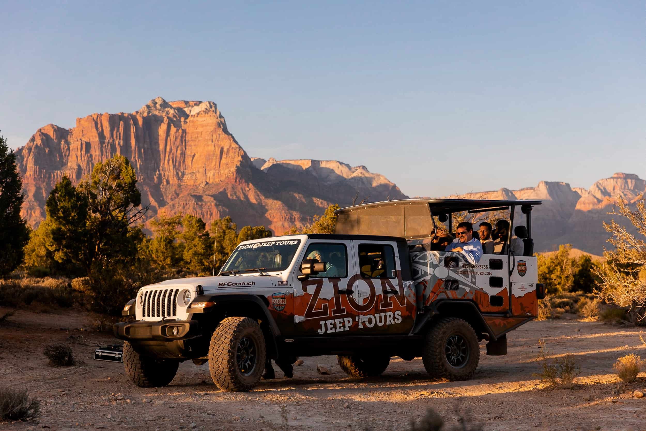 Wedding party ride in a Zion Jeep Tours jeep at sunset with a view of Zion National Park in the background