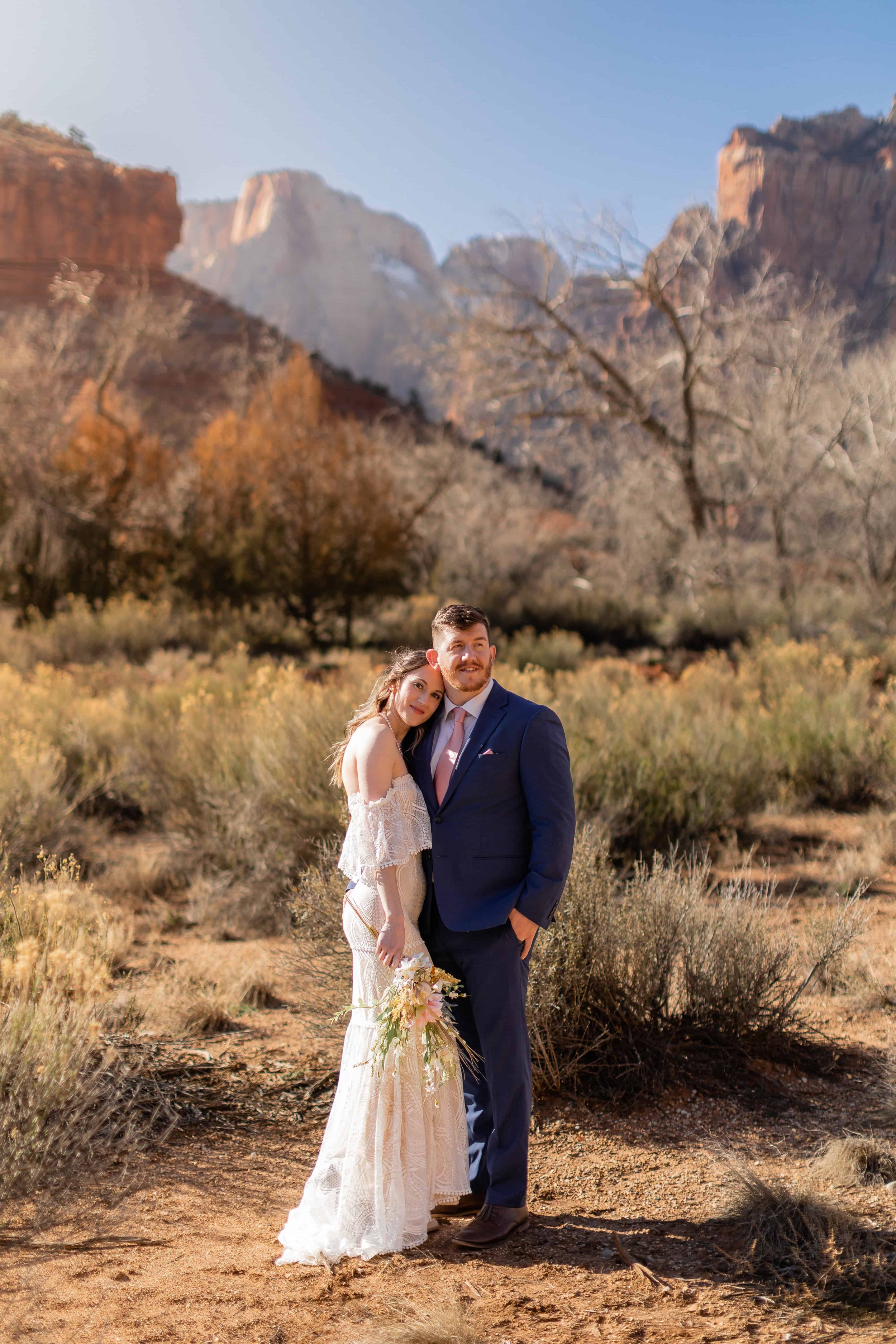 bride and groom pose together after nature center ceremony