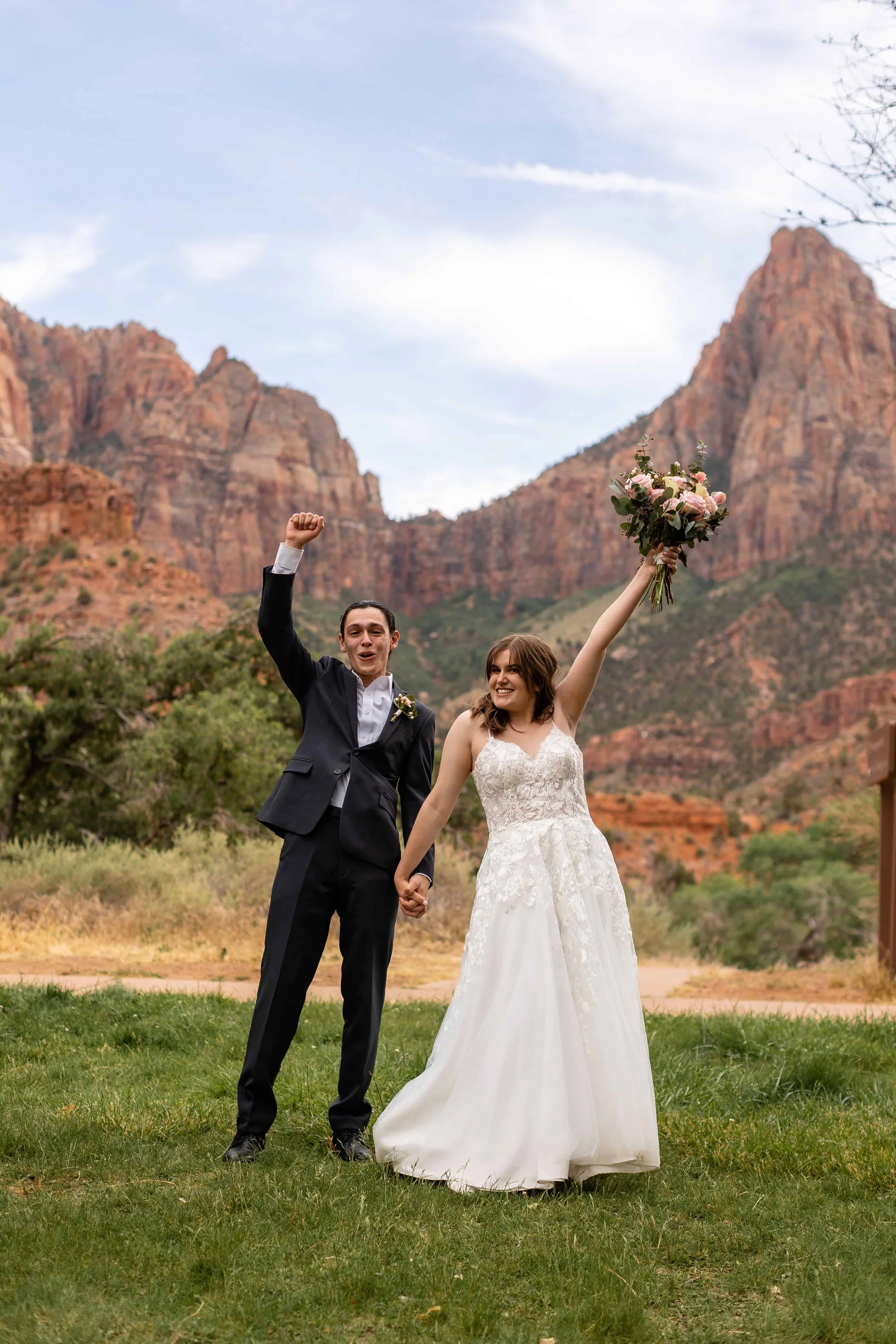 Bride and groom cheer after elopement ceremony at south campground amphitheater ceremony