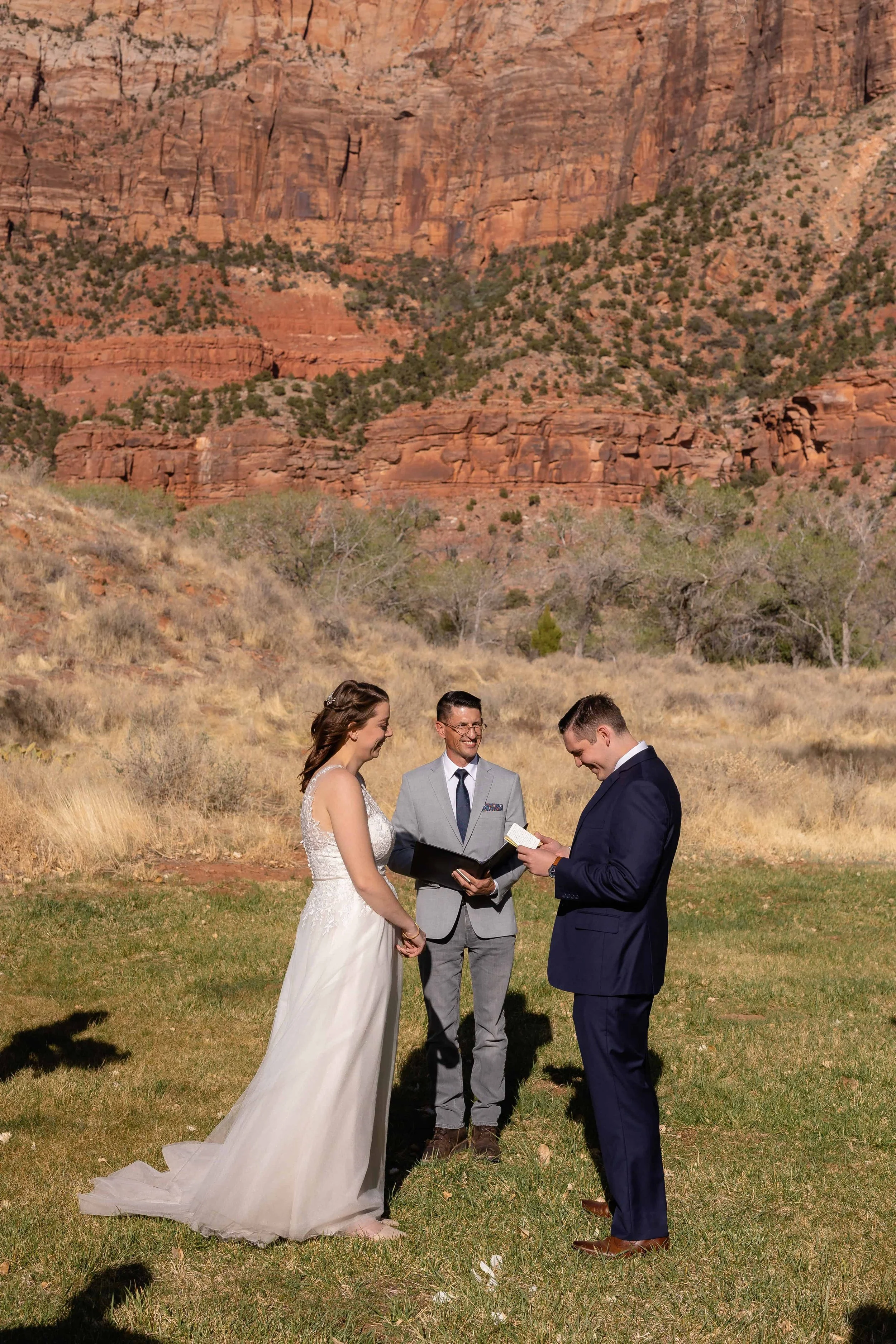 groom reads vows during nature center wedding ceremony