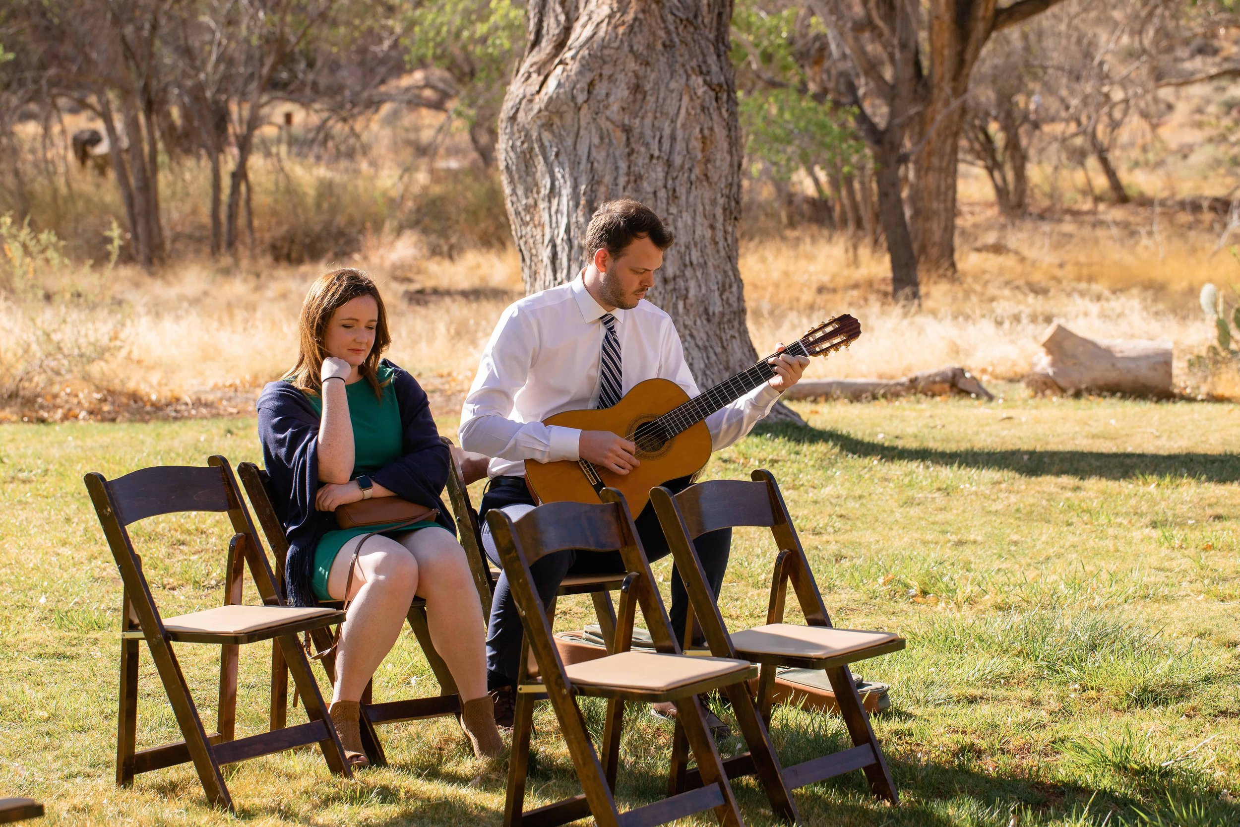 guest plays acoustic guitar at zion nature center north lawn ceremony