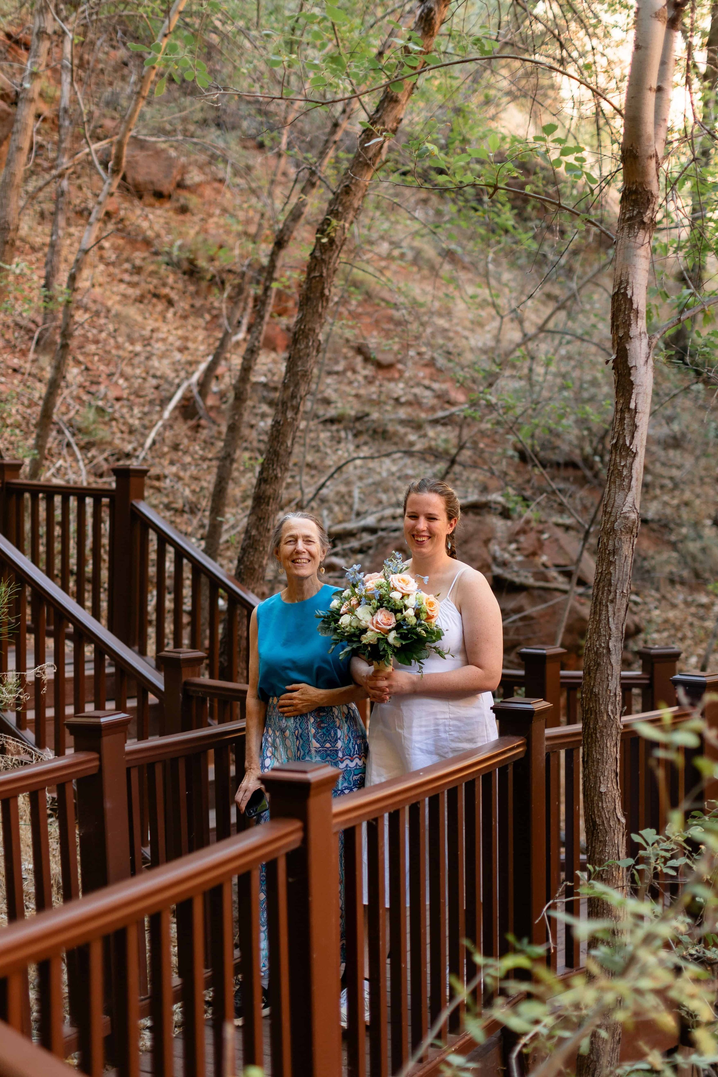bride walks with her mom into wedding ceremony at menu falls in Zion