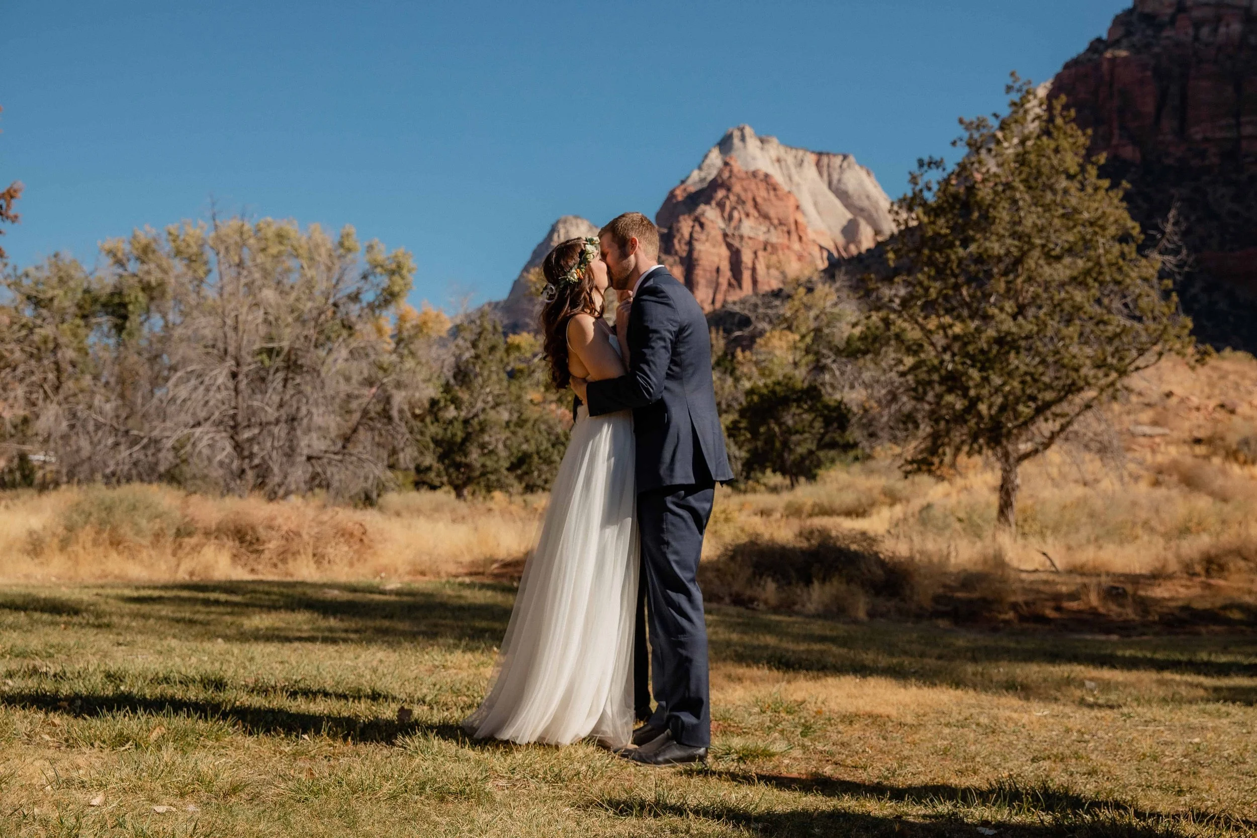 bride and groom kiss at the end ceremony in zion