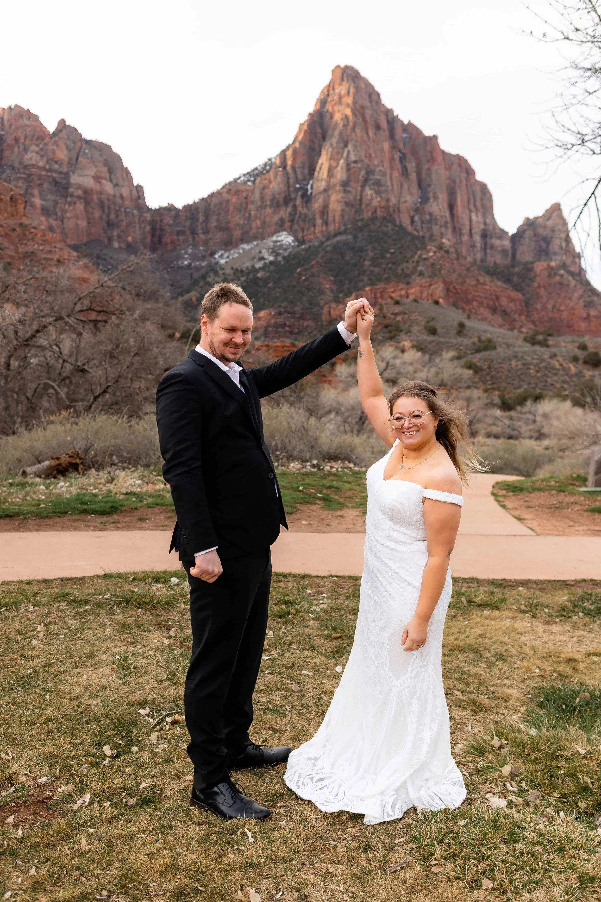 Bride and groom cheer after elopement ceremony at south campground amphitheater ceremony