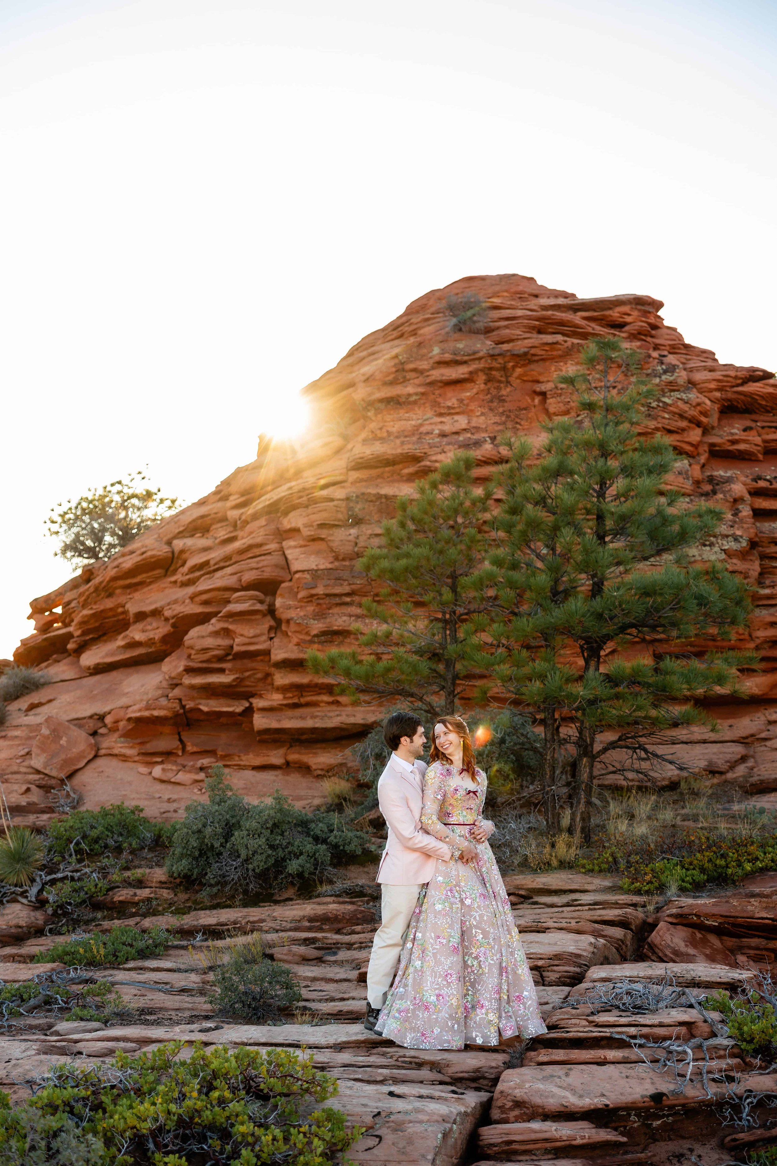 bride and groom pose together during sunset portrait session in zion