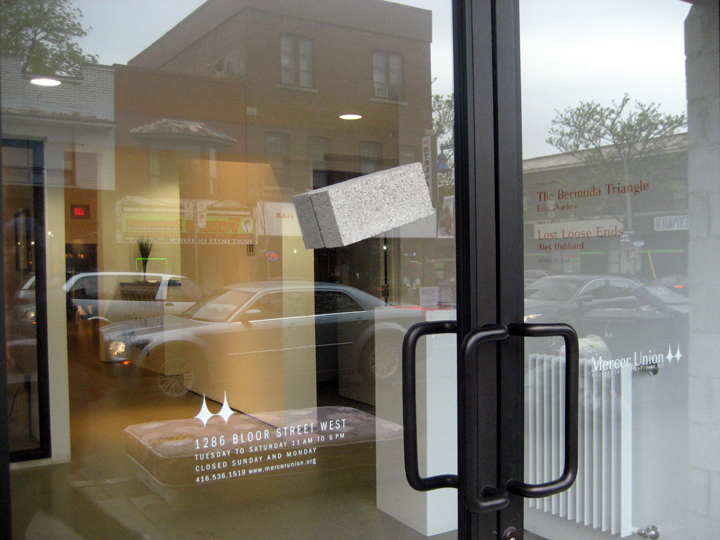   Narcissus Stops To Look At His Dumb Reflection , dimensions variable (2 bricks = 2.25" x 3.5" x 8.5" each), two bricks attached with silicon to either side of gallery storefront window, 2010 