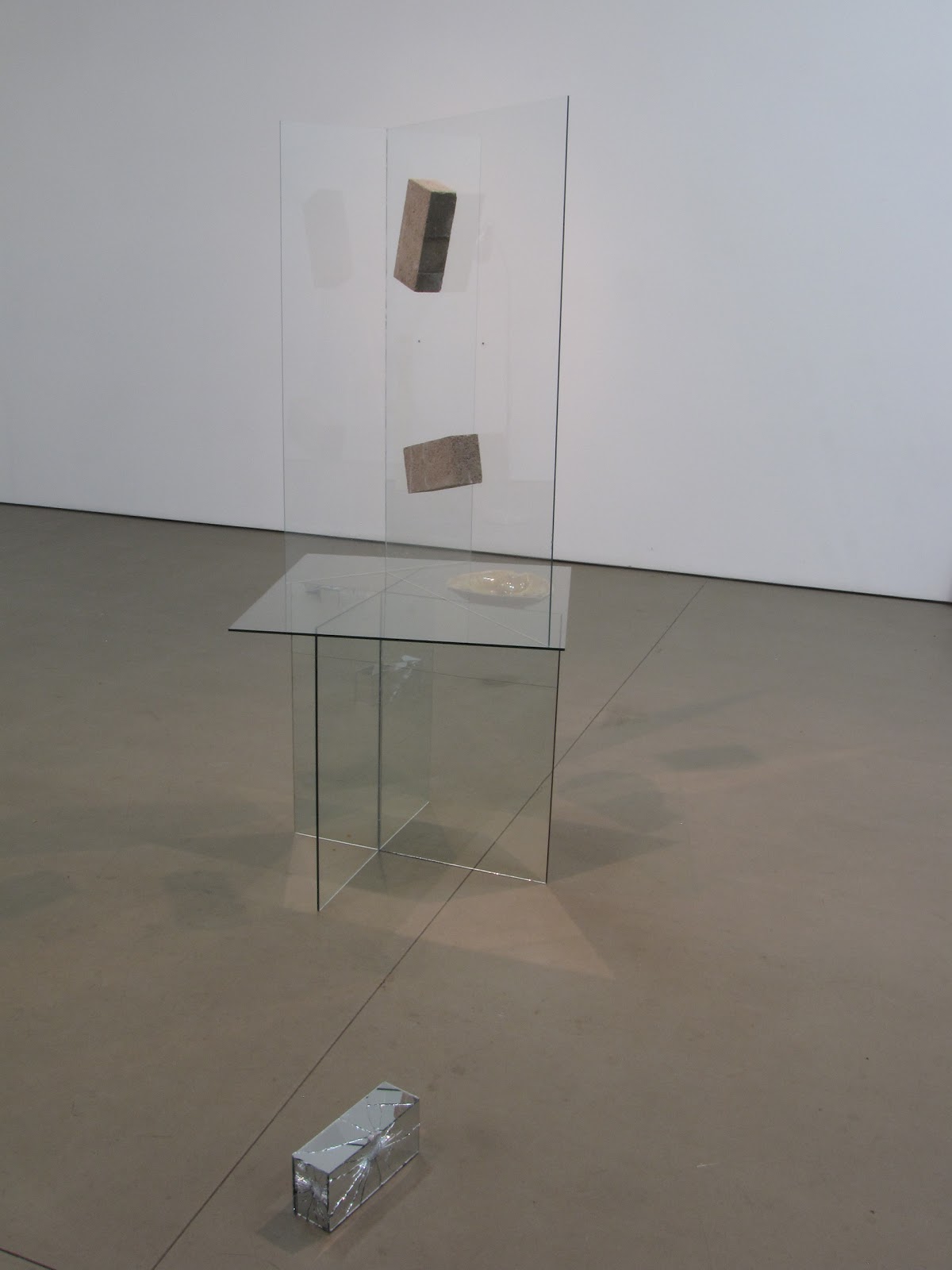   Architect , 60" x 22" x 24", transparent glass, mirror glass, found ashtray, concrete brick, silicon, 2010 