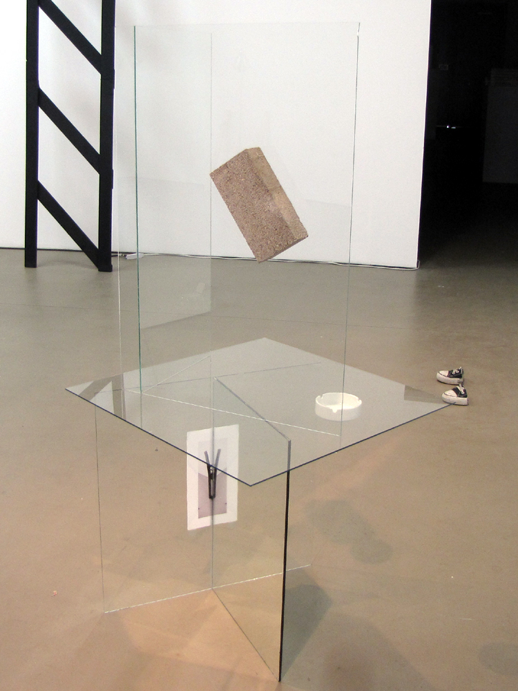  Architect , 58" x 21" x 22", transparent glass, mirror glass, found ashtray, concrete brick, inkjet print on paper, silicon, 2010 