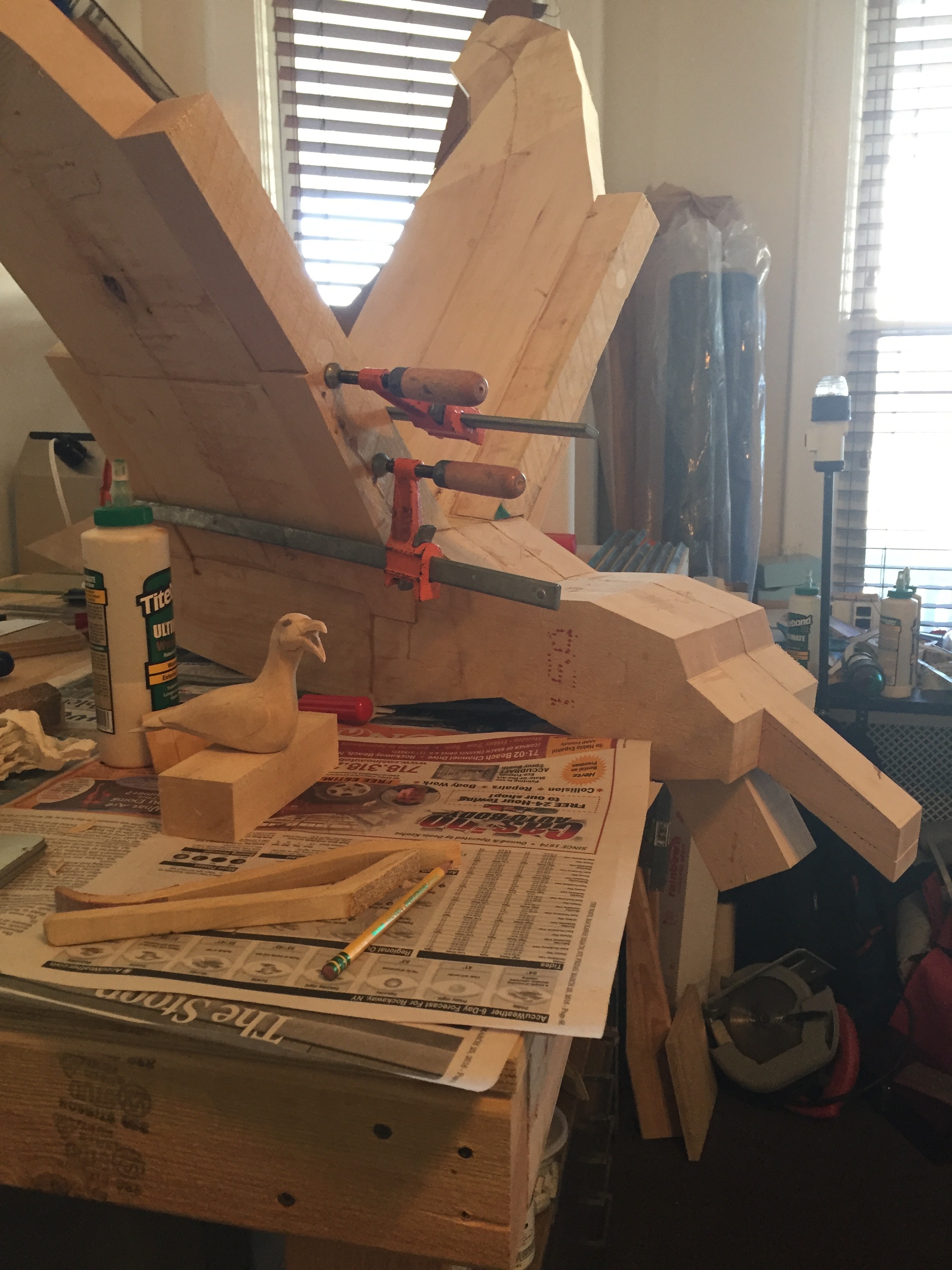 Additional basswood is laminated to the wings in order to develop their shape.