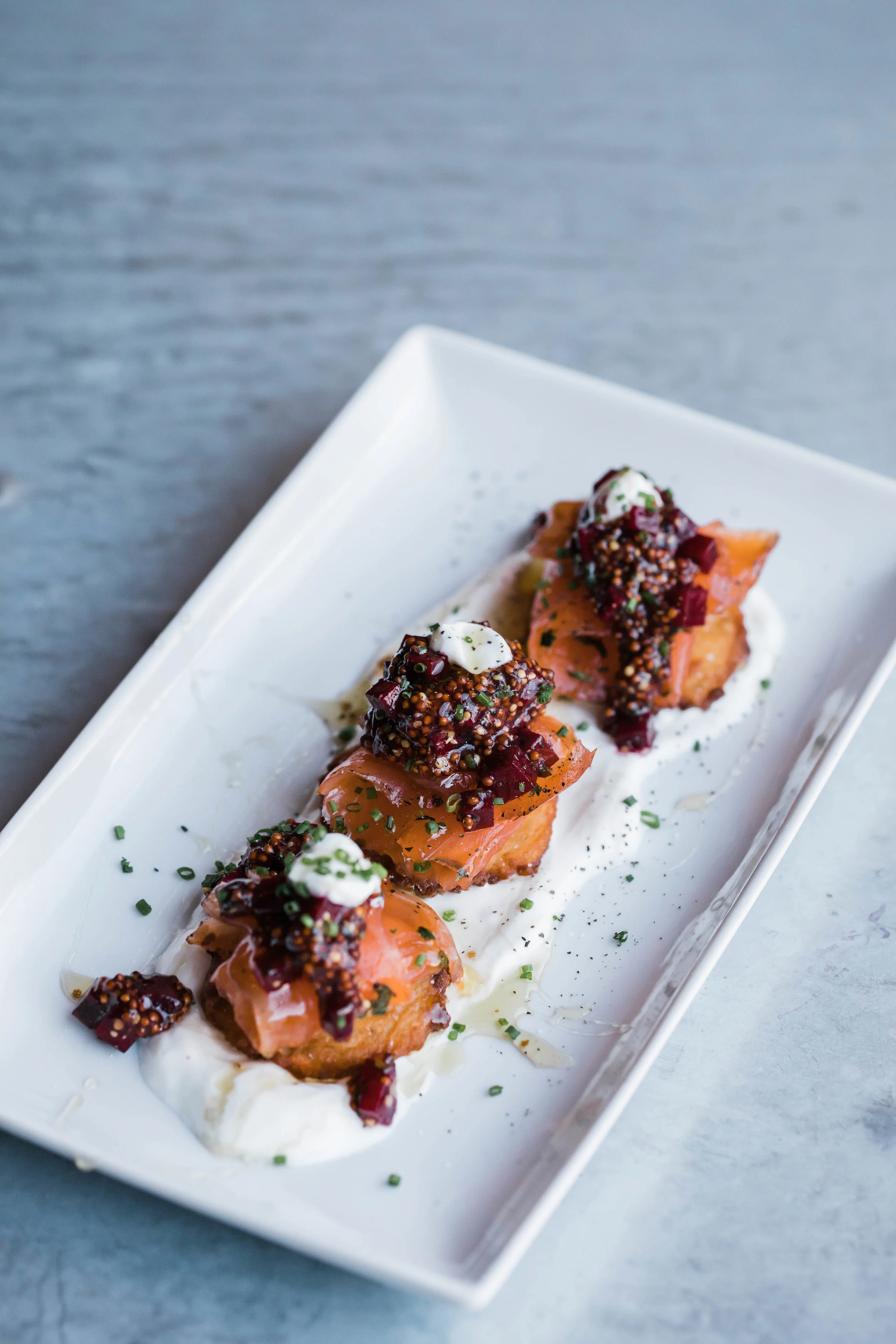 Salmon Gravlax Potato Cakes/ Pickled Beets + Coarse Mustard/ Fromage Blanc/ Truffle Honey