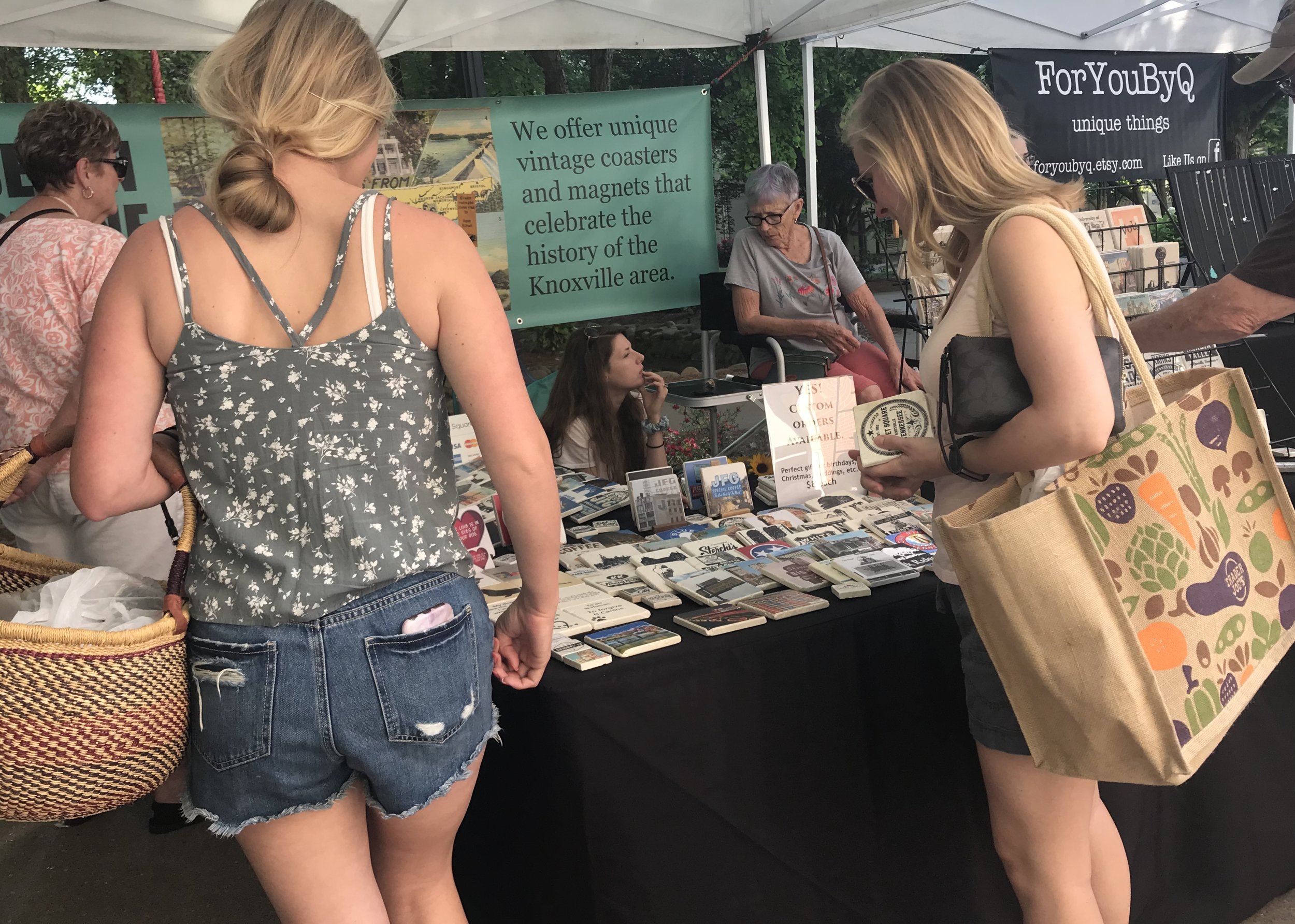 Shoppers study the options at Set in Stone Coasters