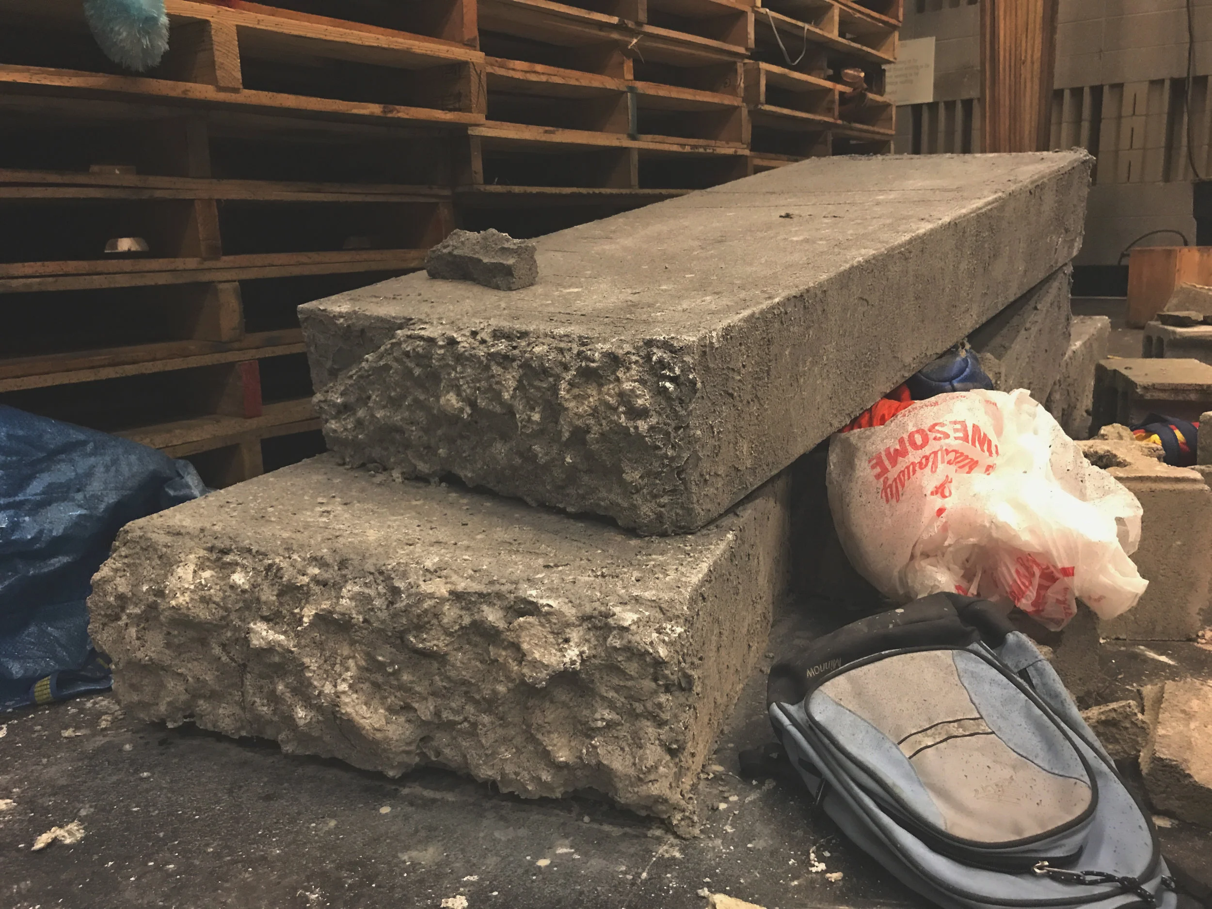 Arden. Concrete block. Wood box fitted with styrofoam ends to give the illusion of severe breakage but still allows actors to walk on them.