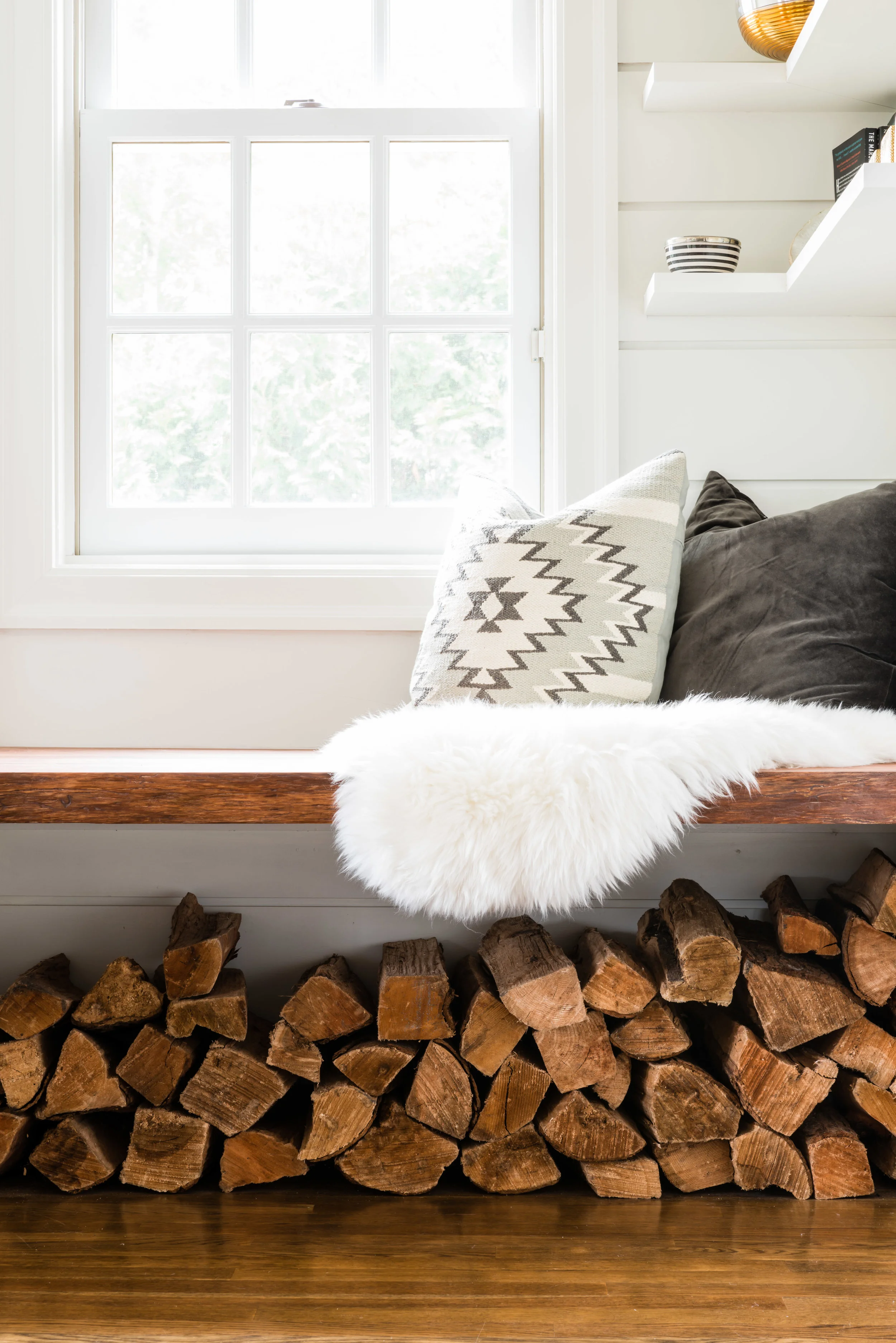 I wish I could take credit for the woodpile under the custom walnut floating seat….but I can’t. My client did this one day and it blew my mind!