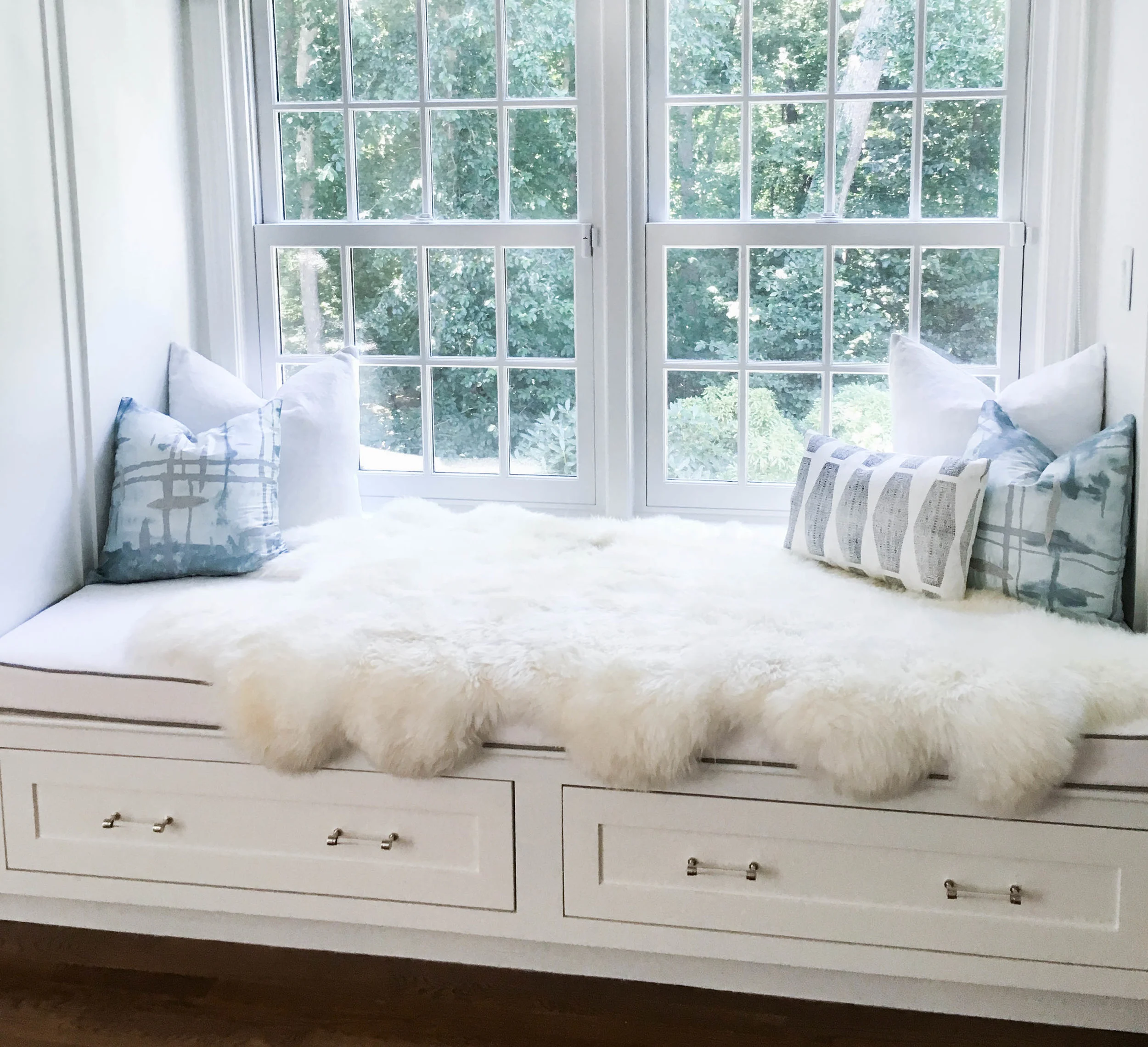 A daybed in our client’s bedroom is draped in a sheepskin rug for extra coziness.