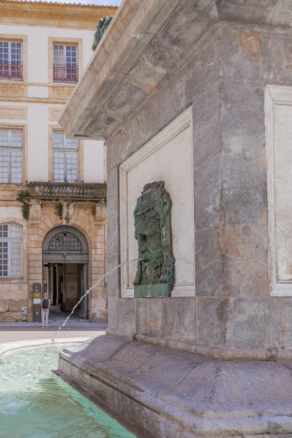 The Arles Obelisk rising in the center of Place de la République fountain