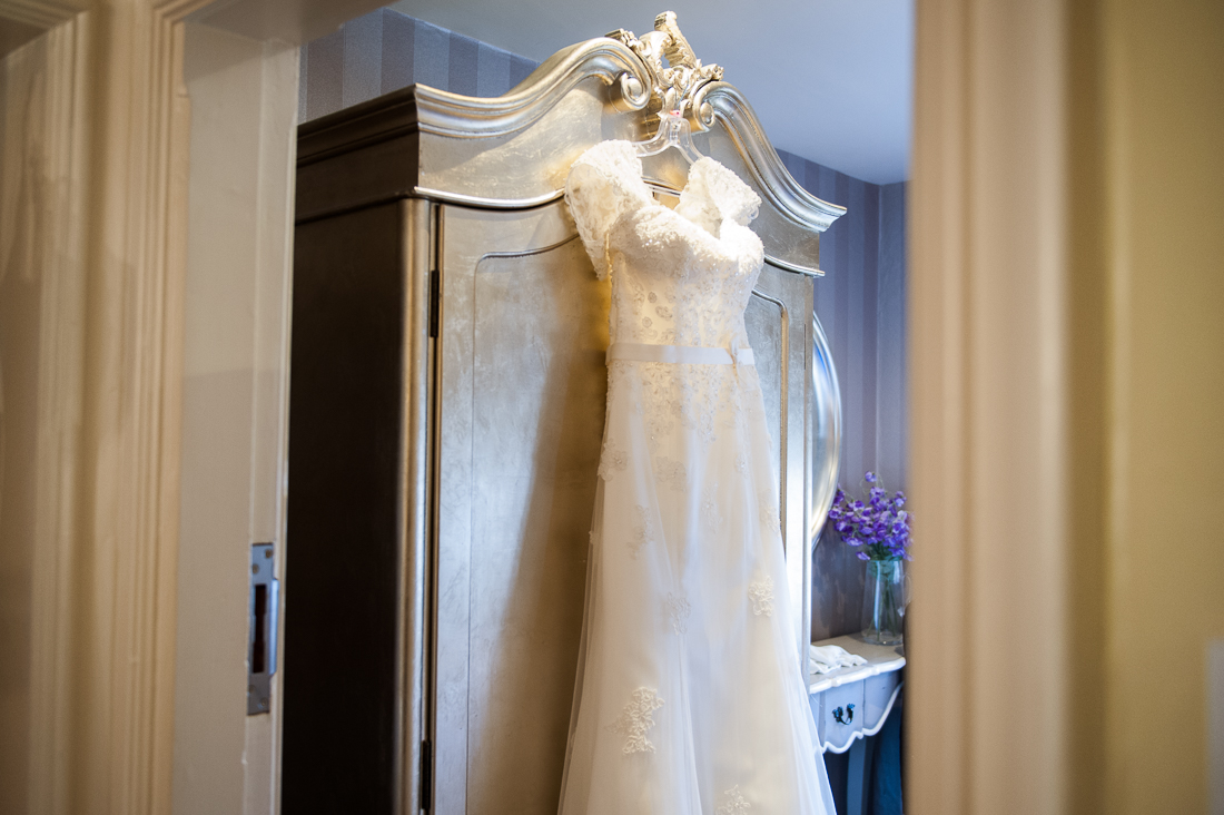 Brides dress hanging on the wardrobe at Eaves Hall.  
