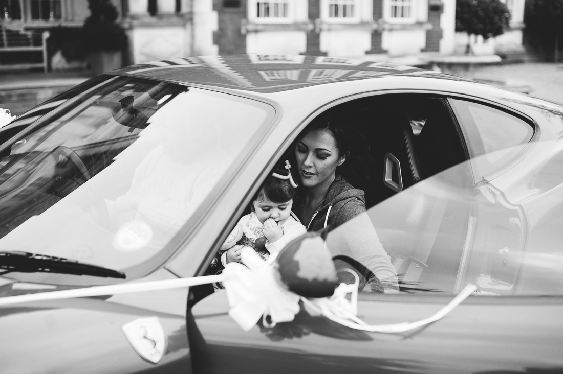 Bride arriving at Eaves Hall in Ferrari. Lancashire wedding photography 