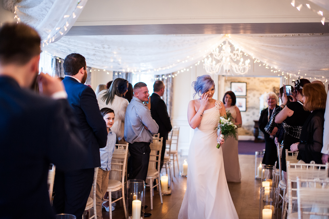 Bridesmaid walking down the isle 