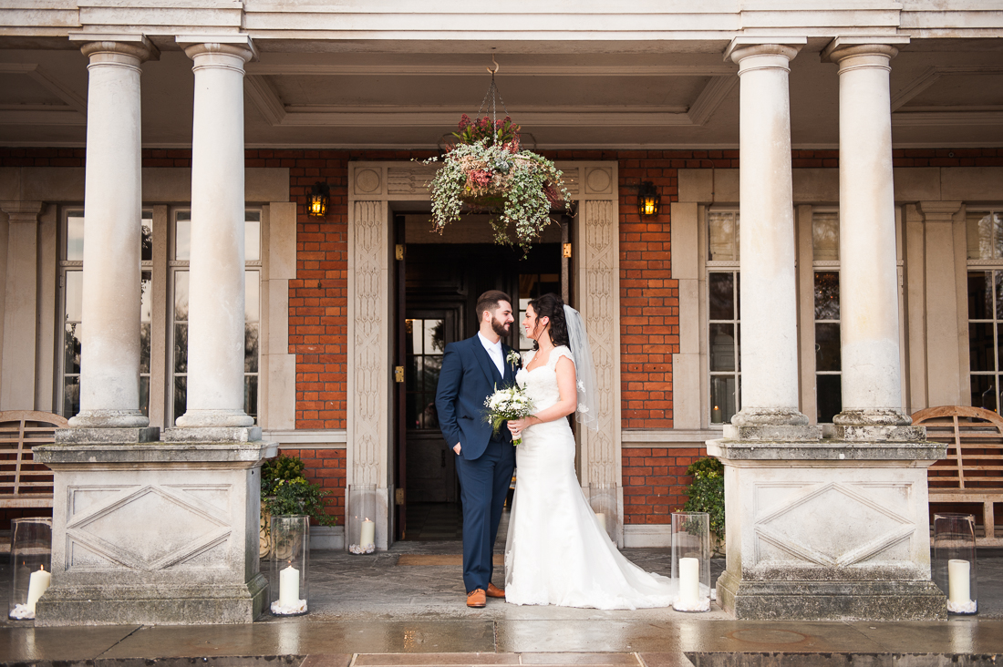Bride and groom outside at Eaves Hall. Natural wedding photography