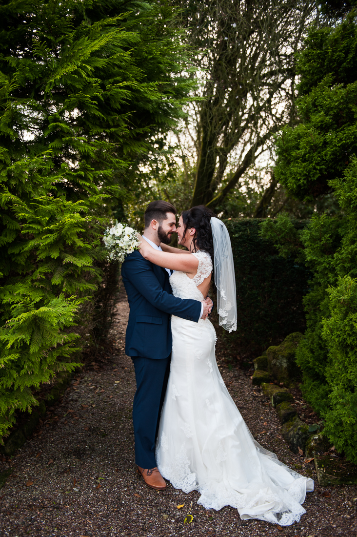 Romantic portrait of the bride and groom kissing. Lancashire wedding photography