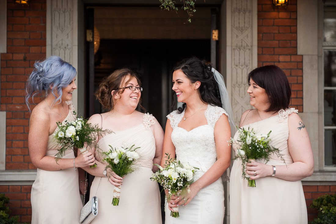 natural shot of bridesmaids laughing 