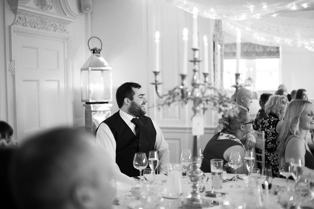 Documentary shot of guests during the wedding breakfast 