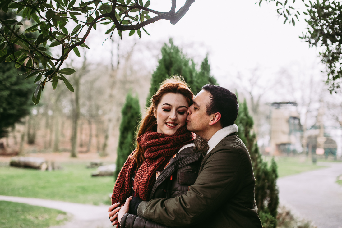 Couple kissing as they hug one another. Natural photography