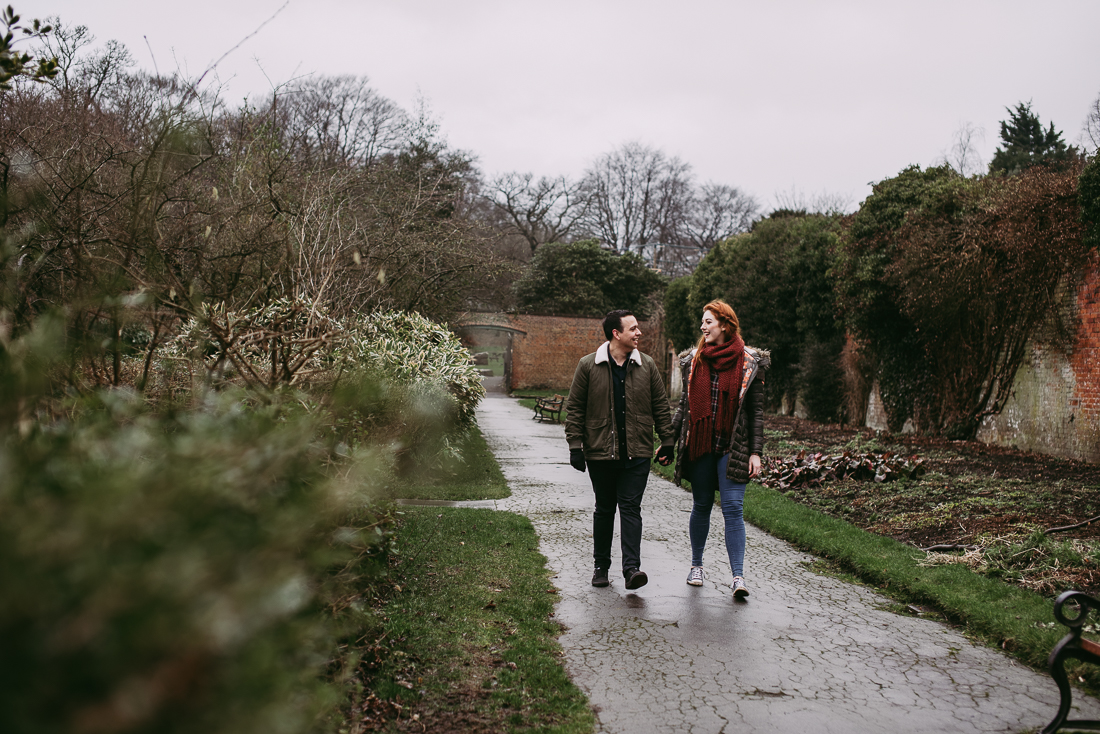 Walking together in the gardens at Haigh Hall. Engagement Photography